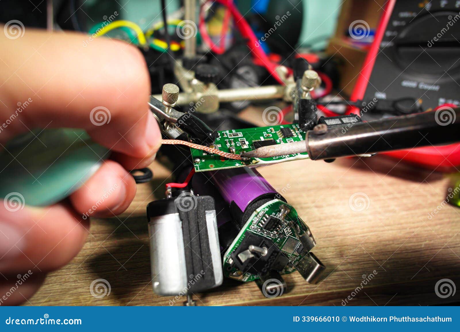 the extraction of lead using desoldering wire or solder wick and soldering iron by an electrician