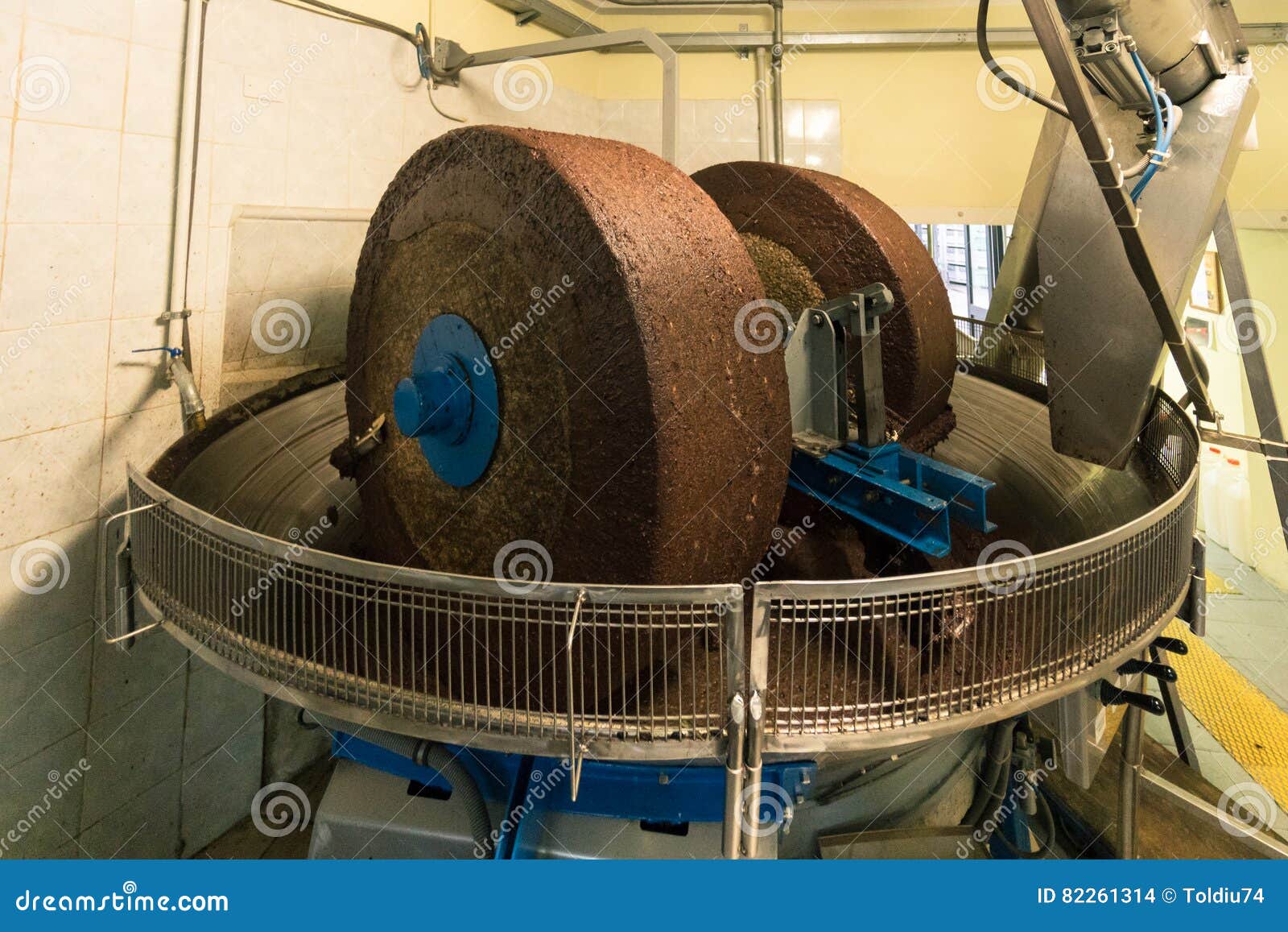 Extraction of Oil from Olives Using a Circular Grinding Stone. Stock