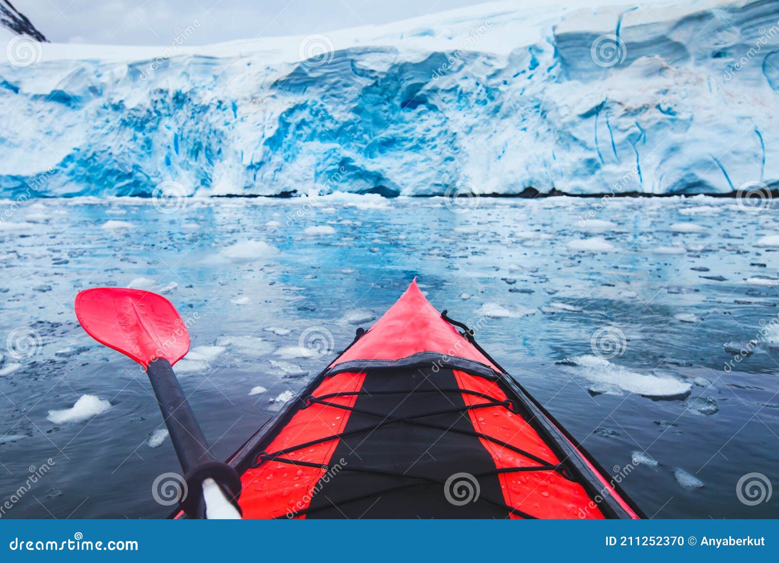 extreme adventure sport, antarctica kayaking, paddling on kayak between antarctic icebergs