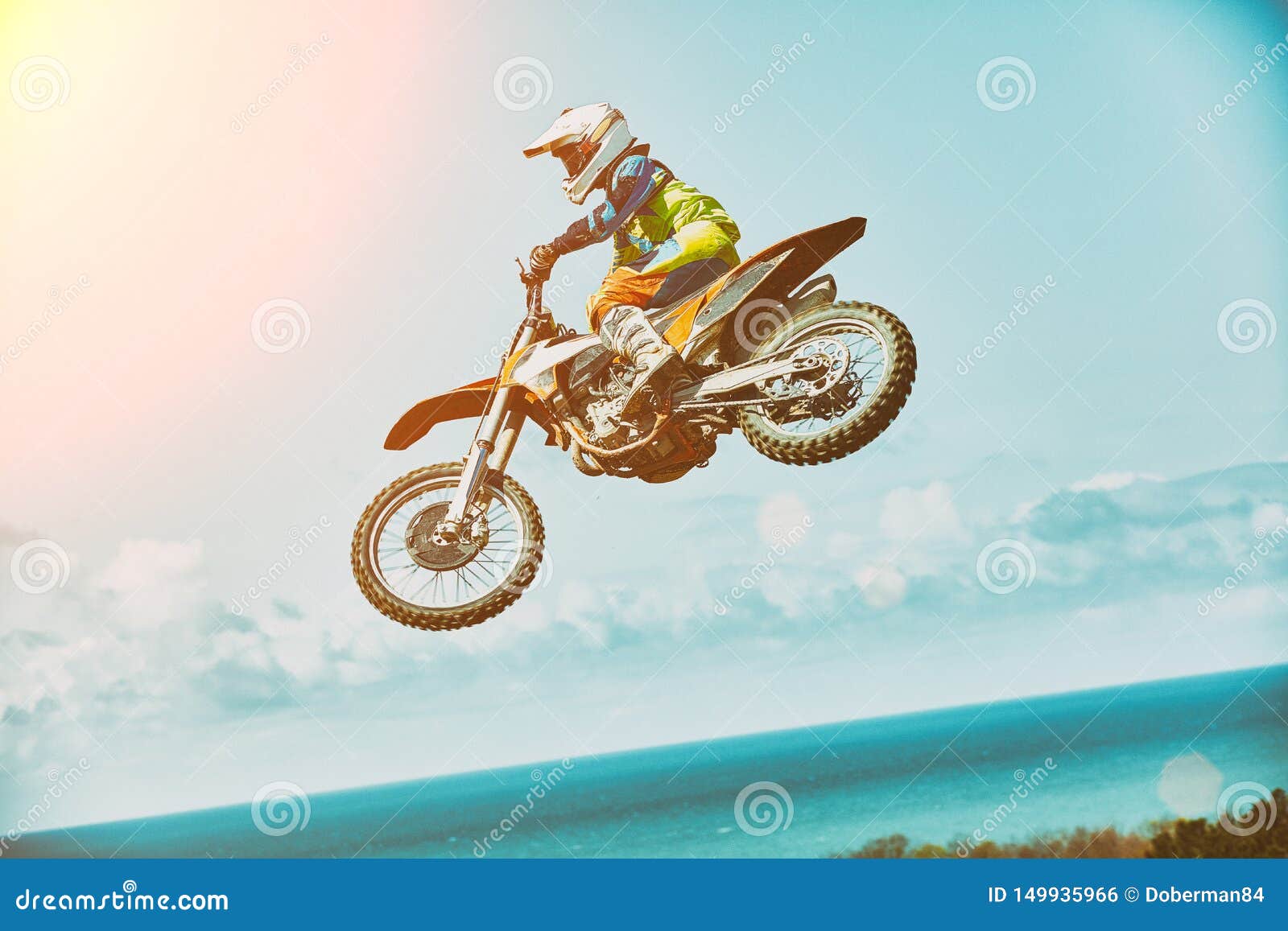 extreme sports, motorcycle jumping. motorcyclist makes an extreme jump against the sky. extreme sports, motorcycle
