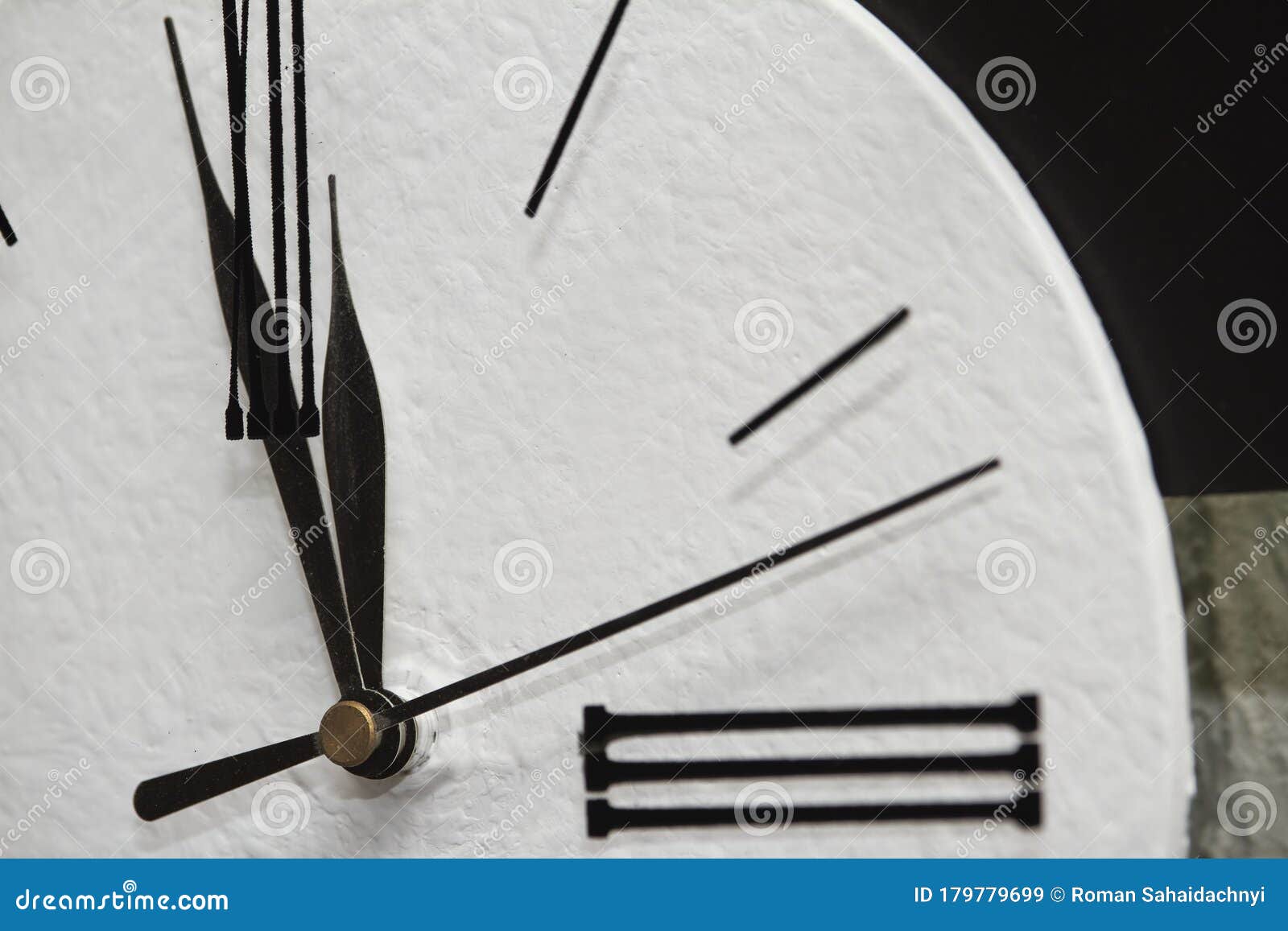 Extremely Closeup Black Clock Hands on a White Dial, Selective Focus