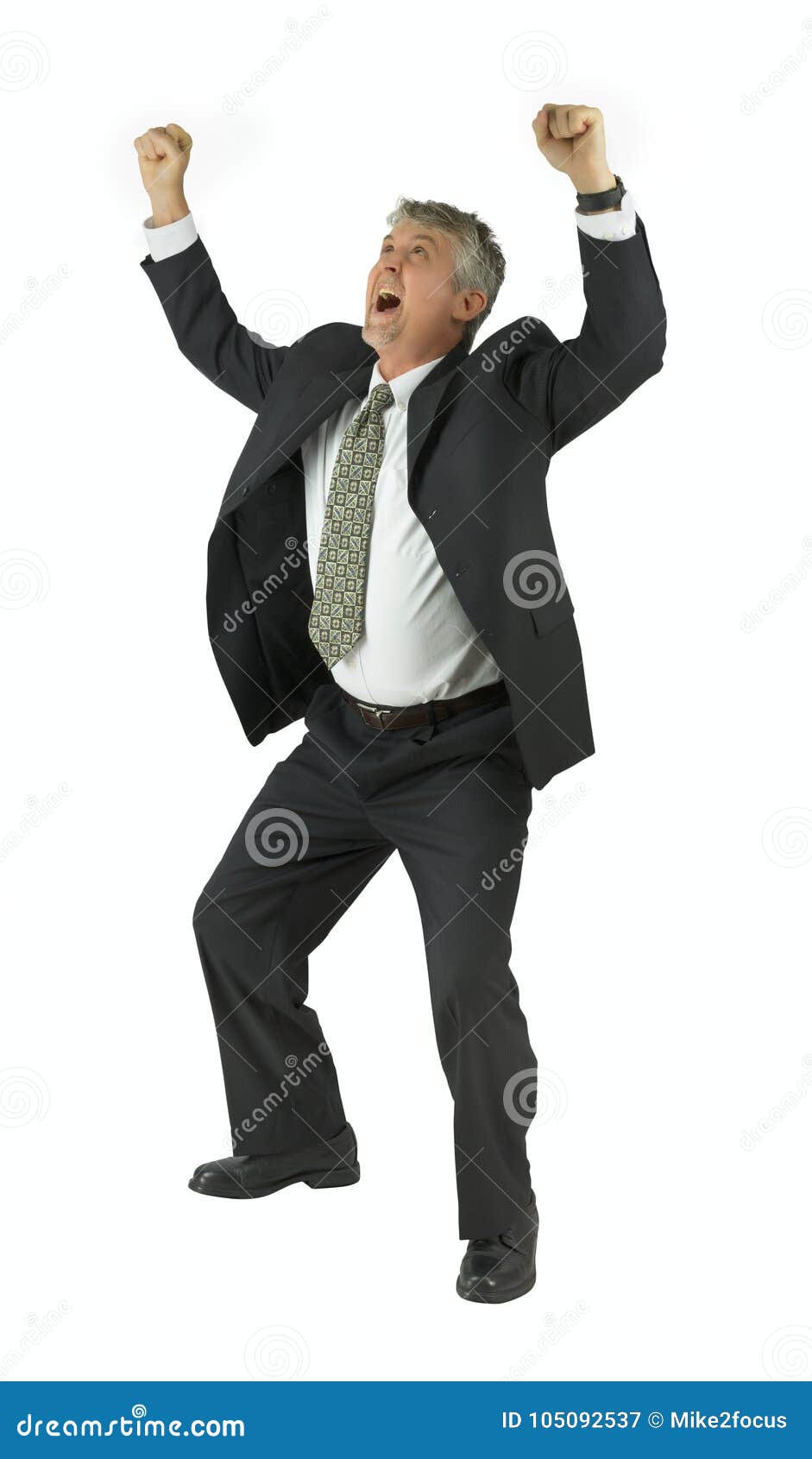 extremely happy man in suit smiling with arms raised victoriously