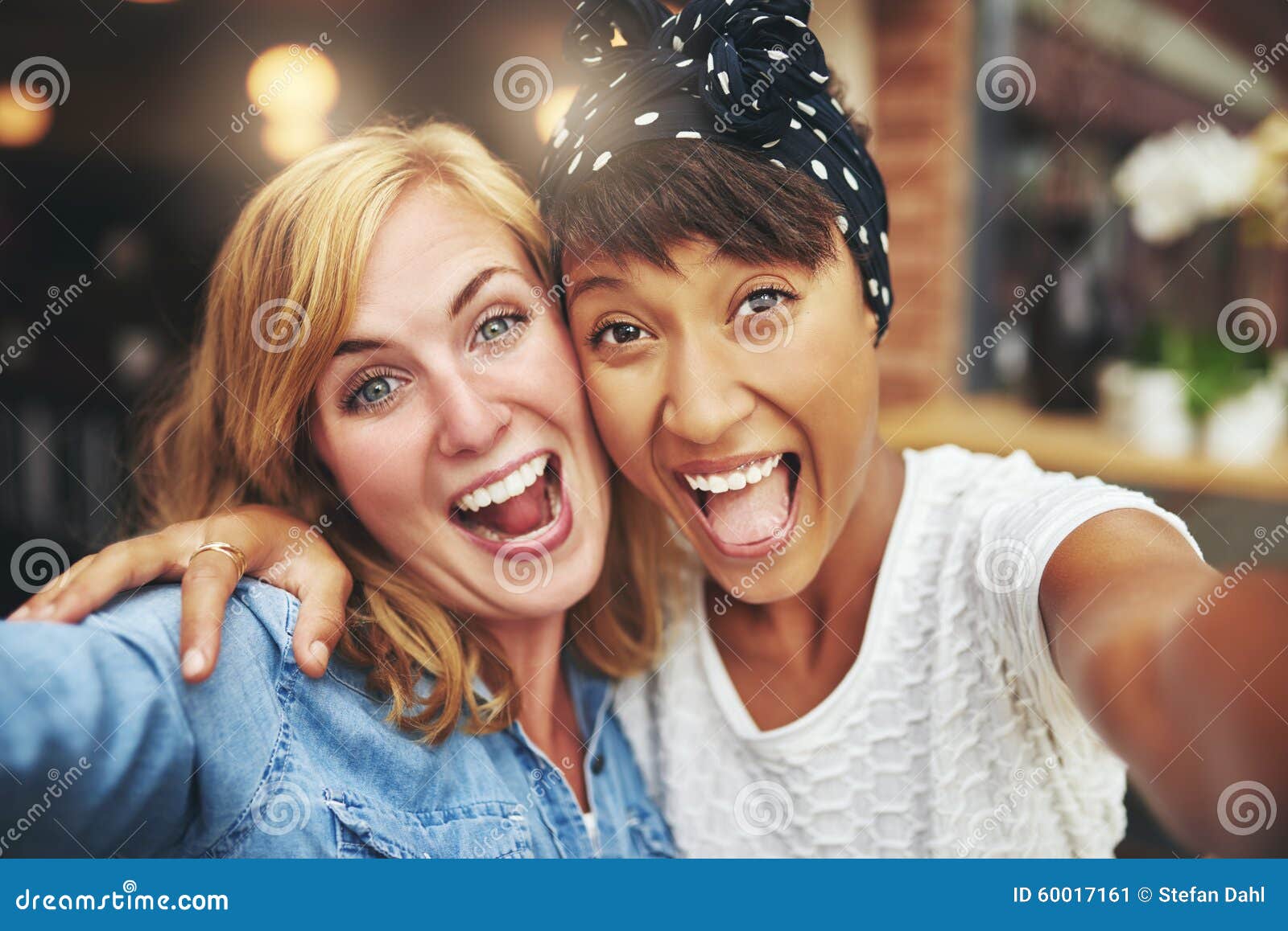 exuberant happy multi ethnic girl friends