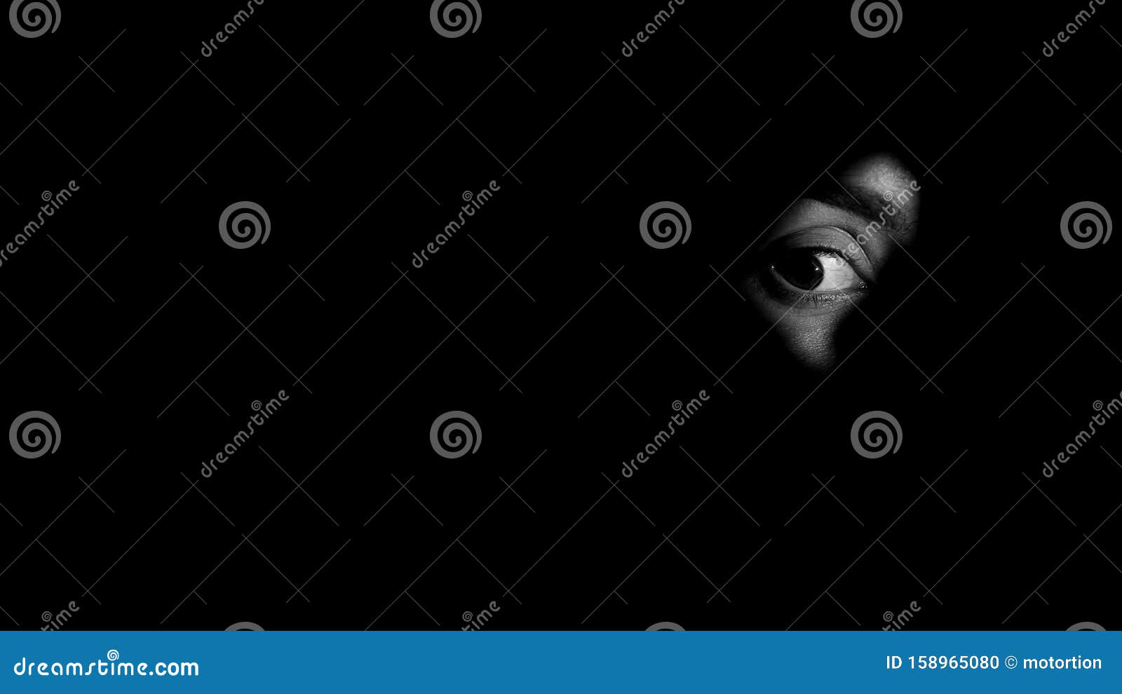 eye of frightened crime witness looking through keyhole, life treatment, closeup