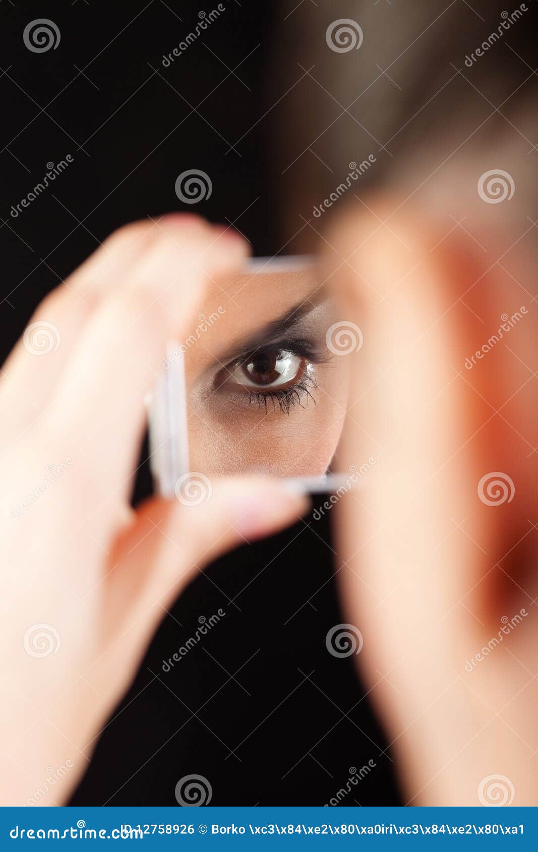 Eye in mirror stock photo. Image of hand, eyes, brown 12758926