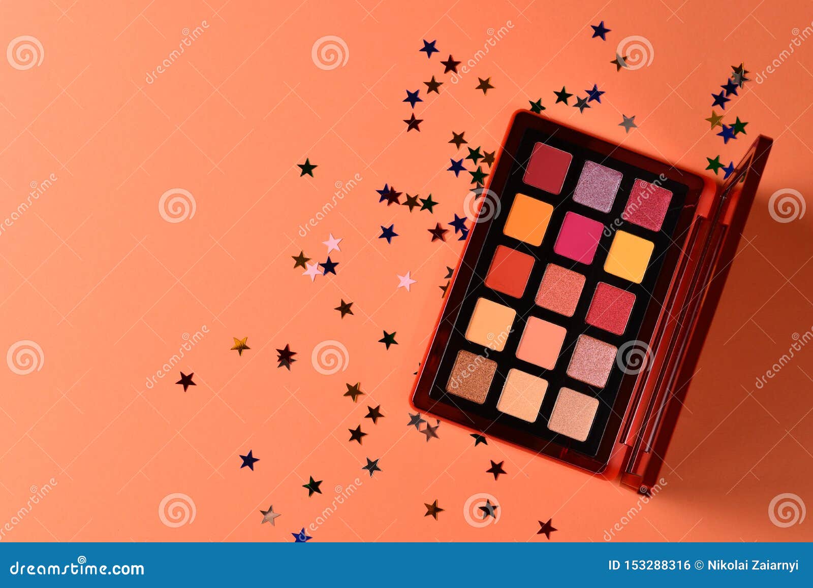Eye Shadow Palette on Orange Background. Copy Space Stock Photo Image