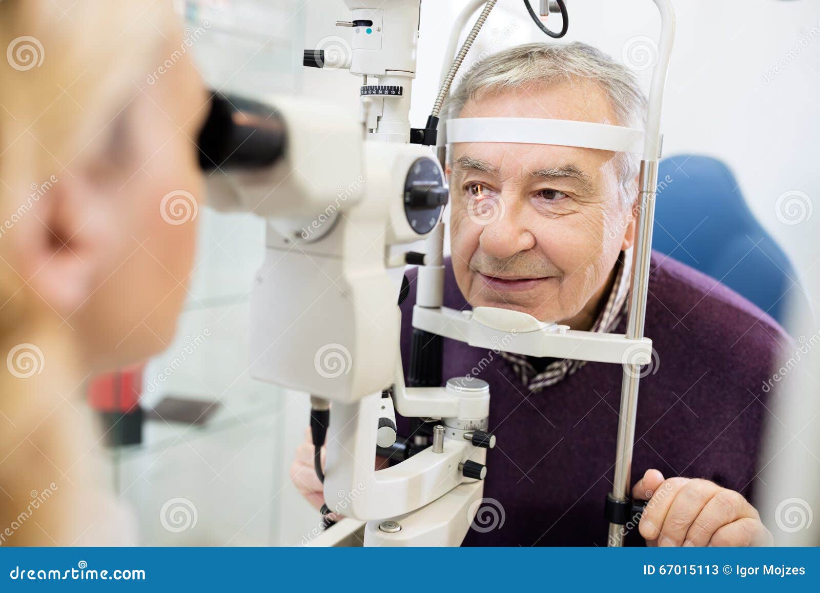 eye specialist determines distance of eyes pupil to patient