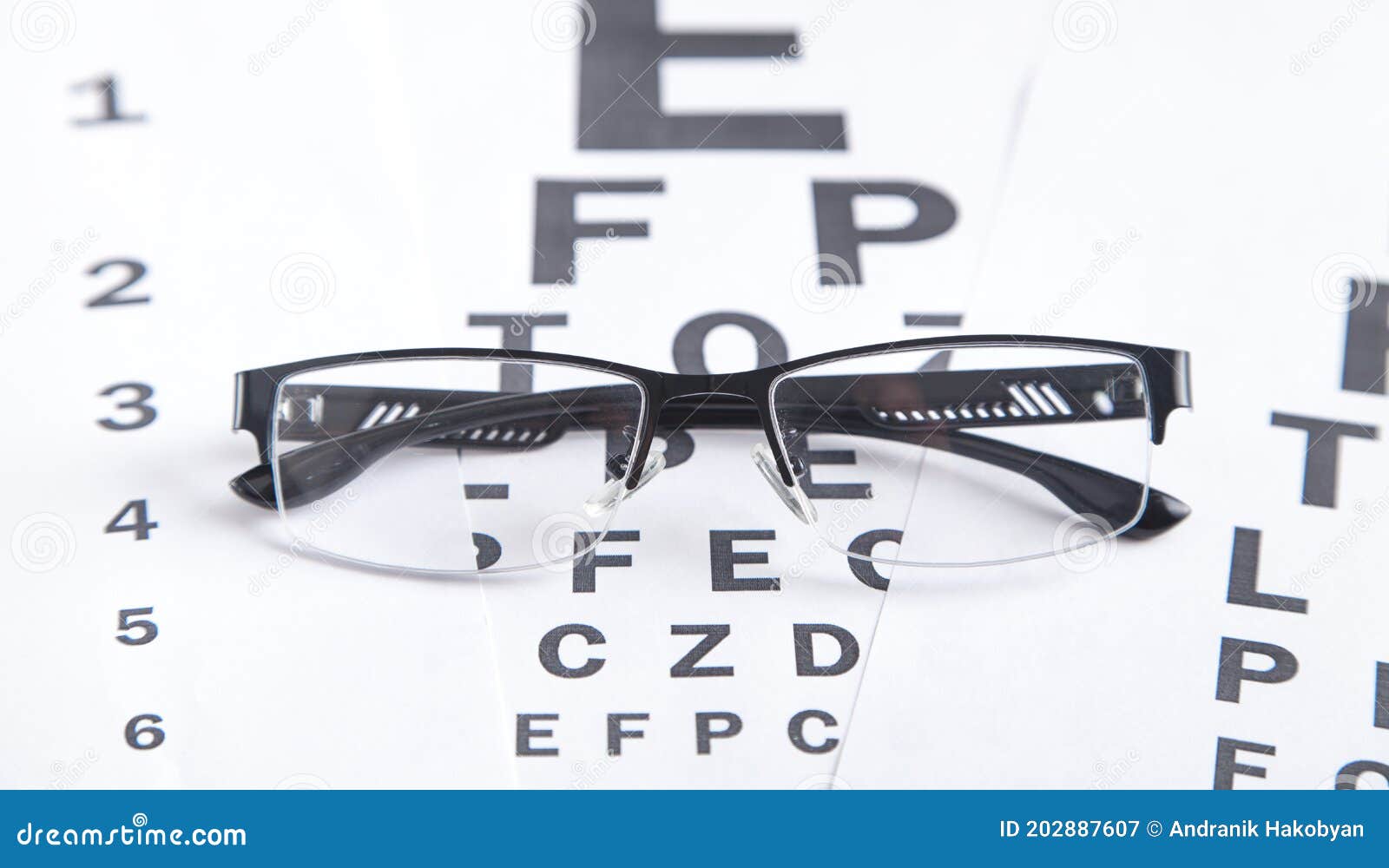 Eye Test Chart with Eyeglasses. Medical Eye Diagnostic Stock Image