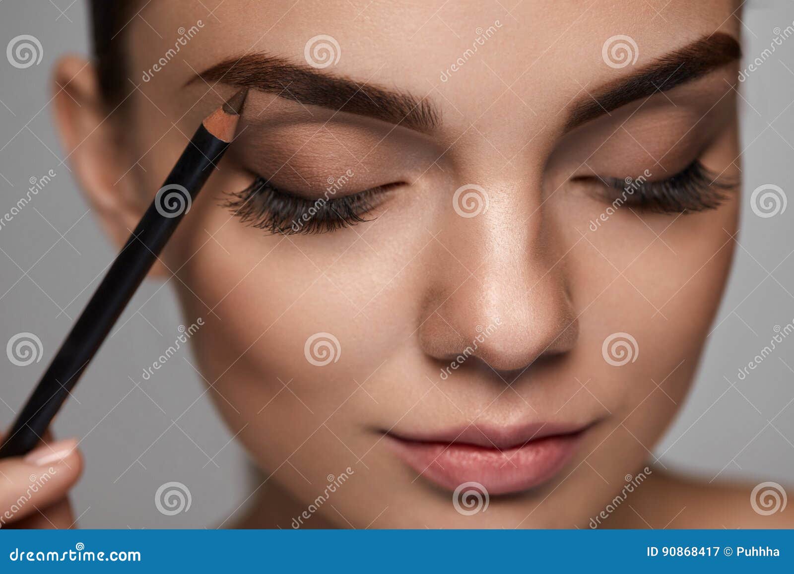 eyebrows contouring. beautiful woman with brown eyebrow pencil