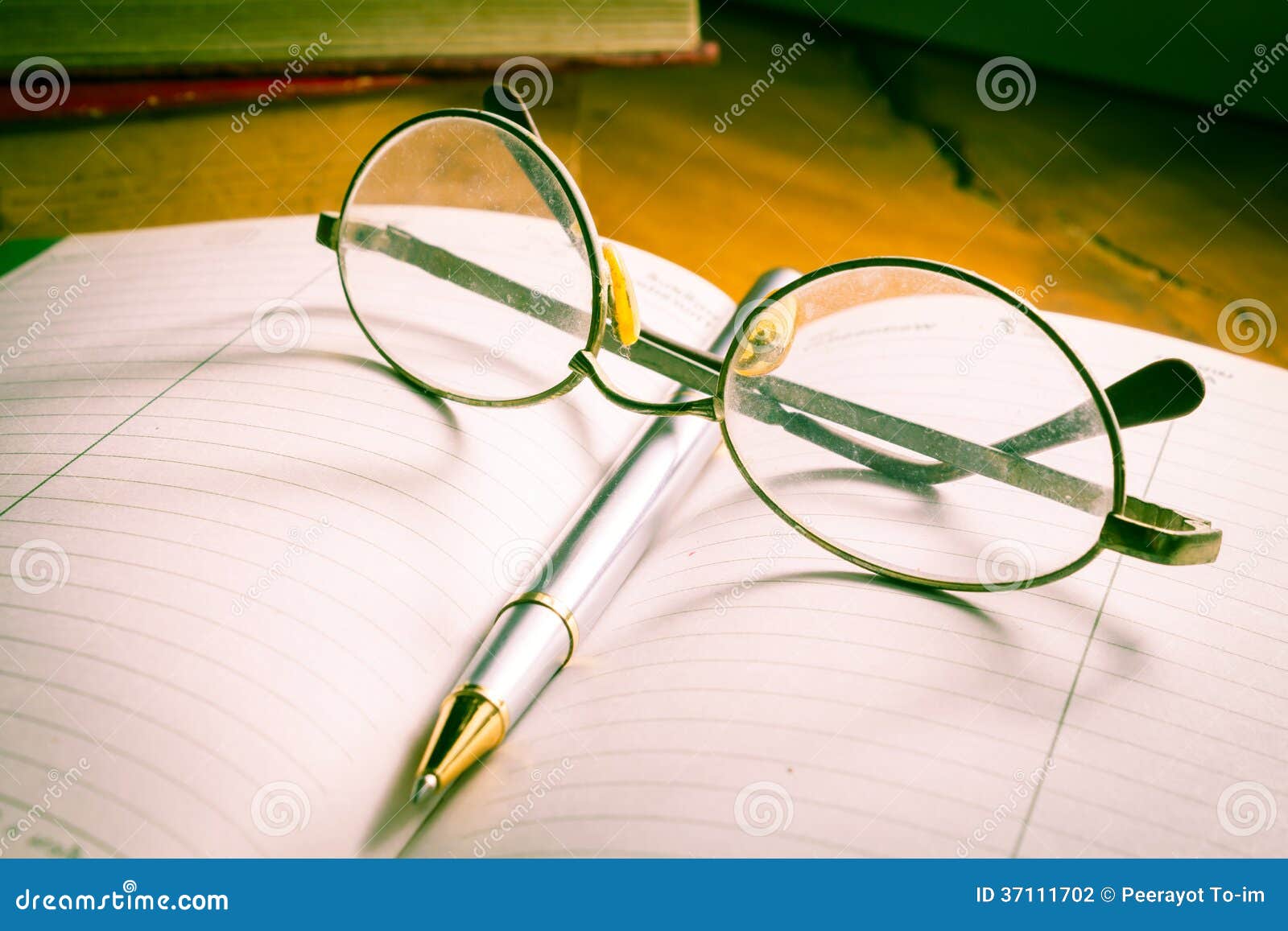 Eyeglasses and Pen on Book. Stock Photo Image of open, object 37111702