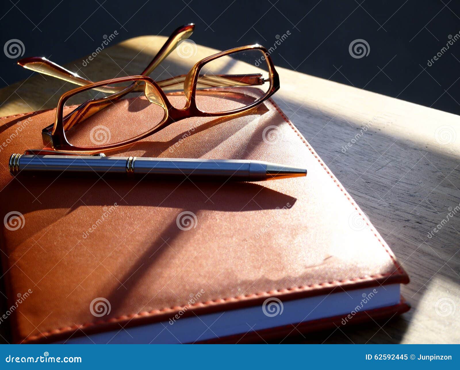 Eyeglasses, Pen and Notebook Stock Image Image of shadow, frame 62592445