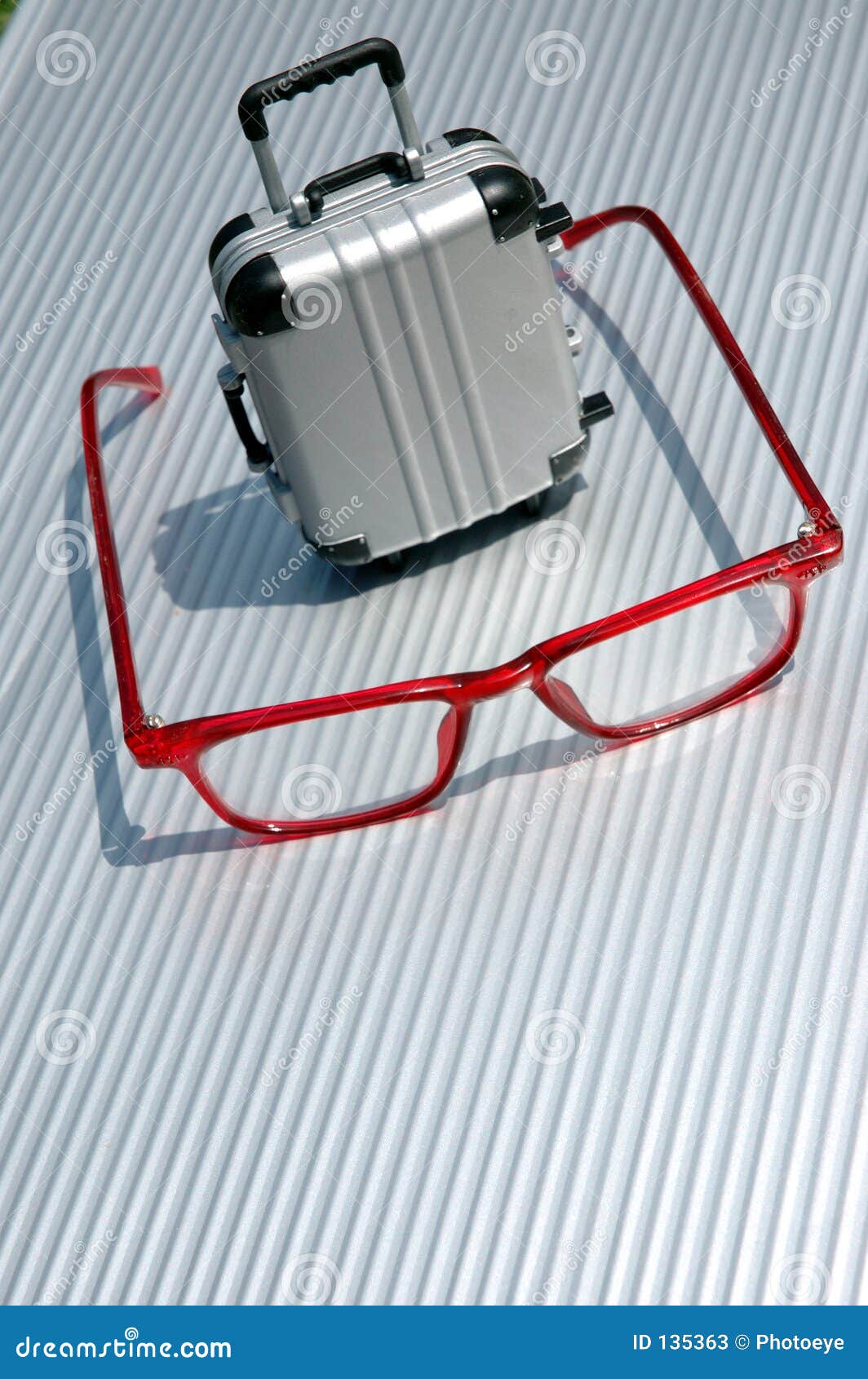 Eyeglasses and suitcase 5 stock image. Image of roll, move 135363