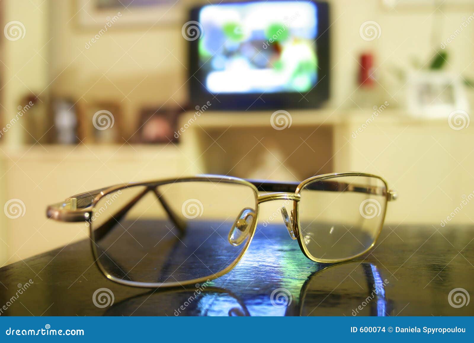 Eyeglasses and tv set stock photo. Image of sight, health 600074