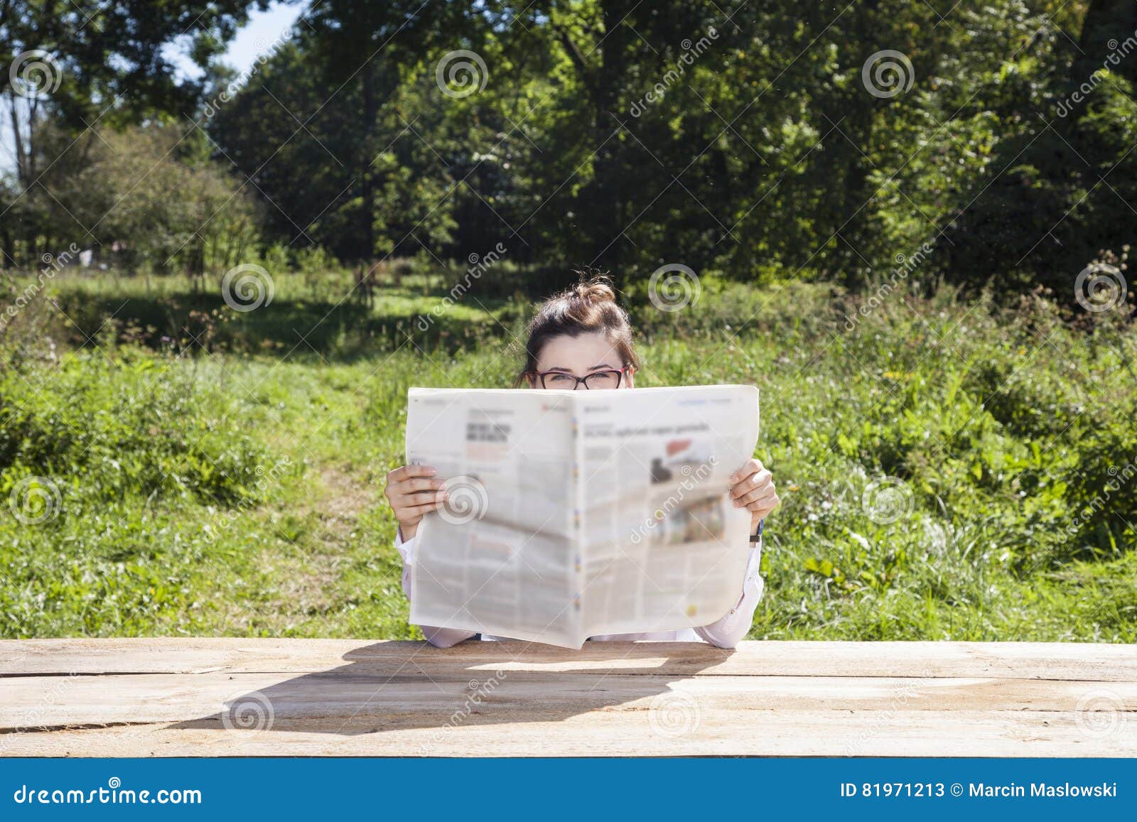 eyes protrude a newspaper