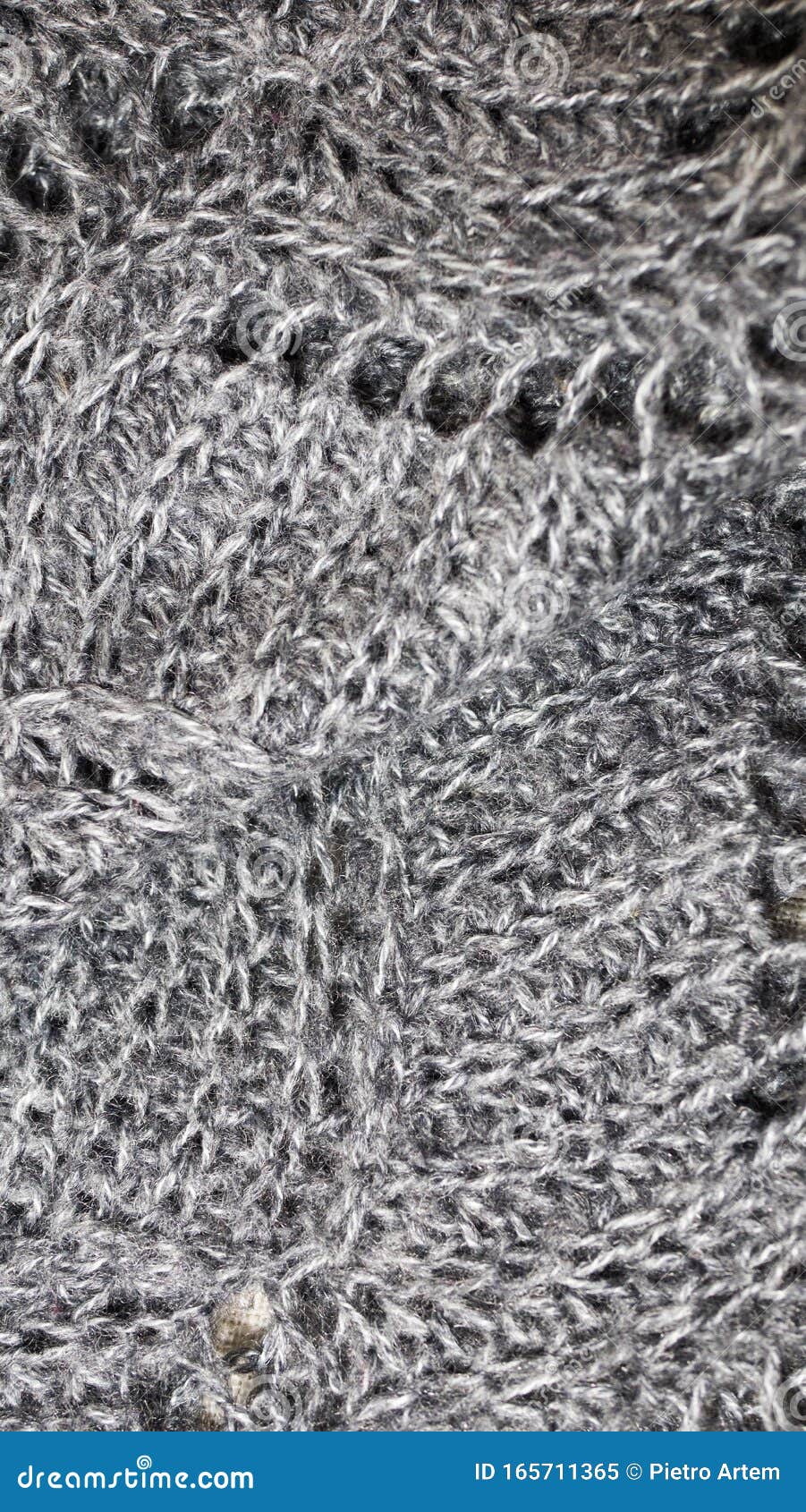 fabric background with metallic weave.  coarse woven gray material with shiny inserts.  texture of rough curtain fabric with inter