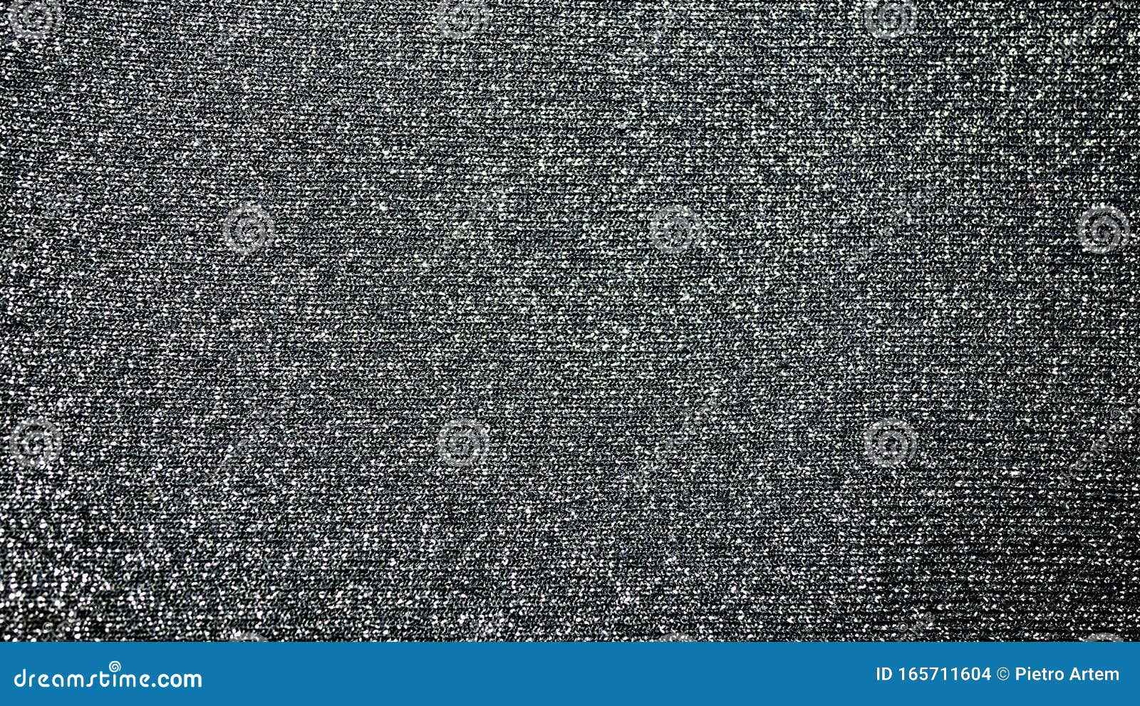 fabric background with metallic weave.  coarse woven gray material with shiny inserts.  texture of rough curtain fabric with inter