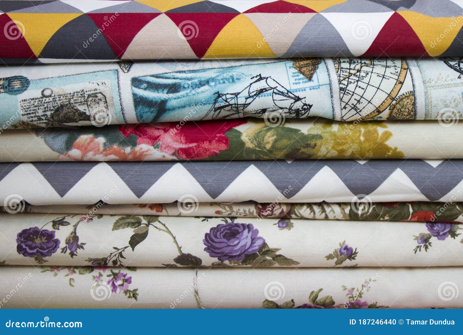 fabricate silk and cloth on the shop shelf, rolled silk in the market, multicolor and many pattern texture background