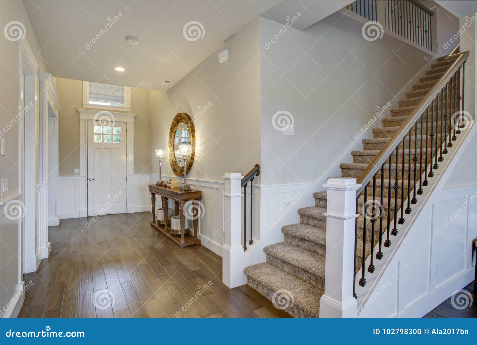 fabulous foyer features a staircase