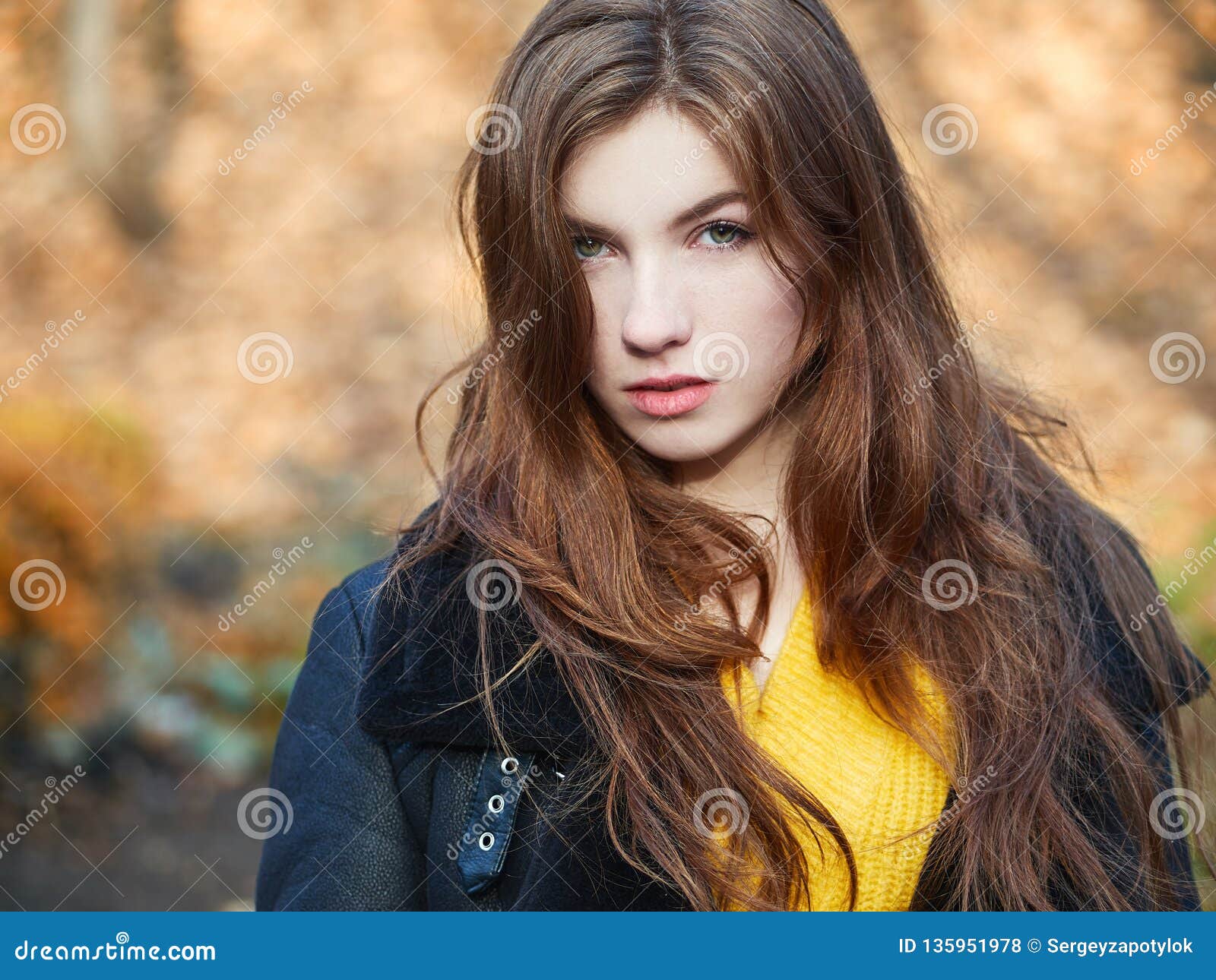 Fabulous Redhead Woman with Long Hair in Yellow Sweater Black Leather ...