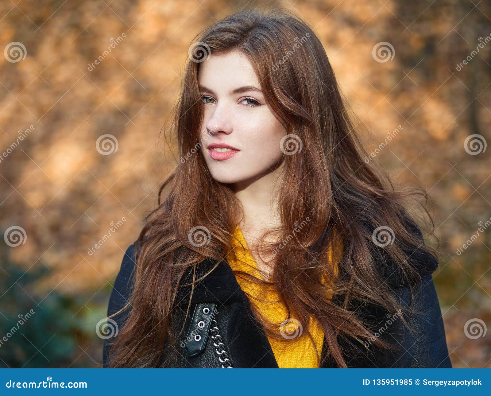 Fabulous Redhead Woman with Long Hair in Yellow Sweater Black Leather ...