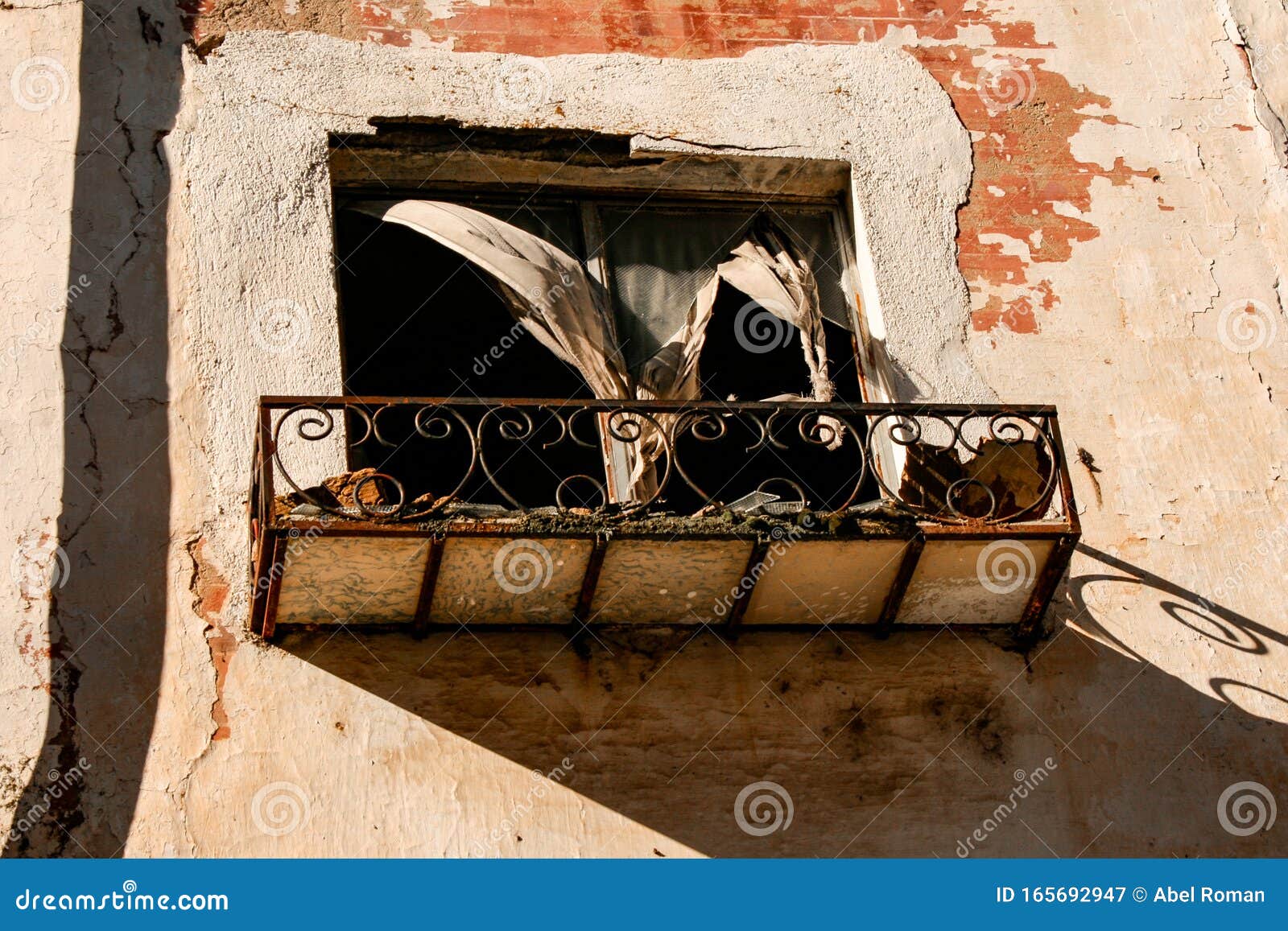 facade of an abandoned building with collapsed window and broken curtains abrir en el traductor de google	 enviar comentarios res