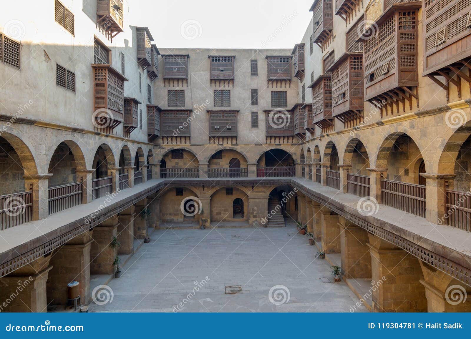 caravansary wikala of bazaraa, with vaulted arcades and windows covered by interleaved wooden grids mashrabiyya, cairo, egypt