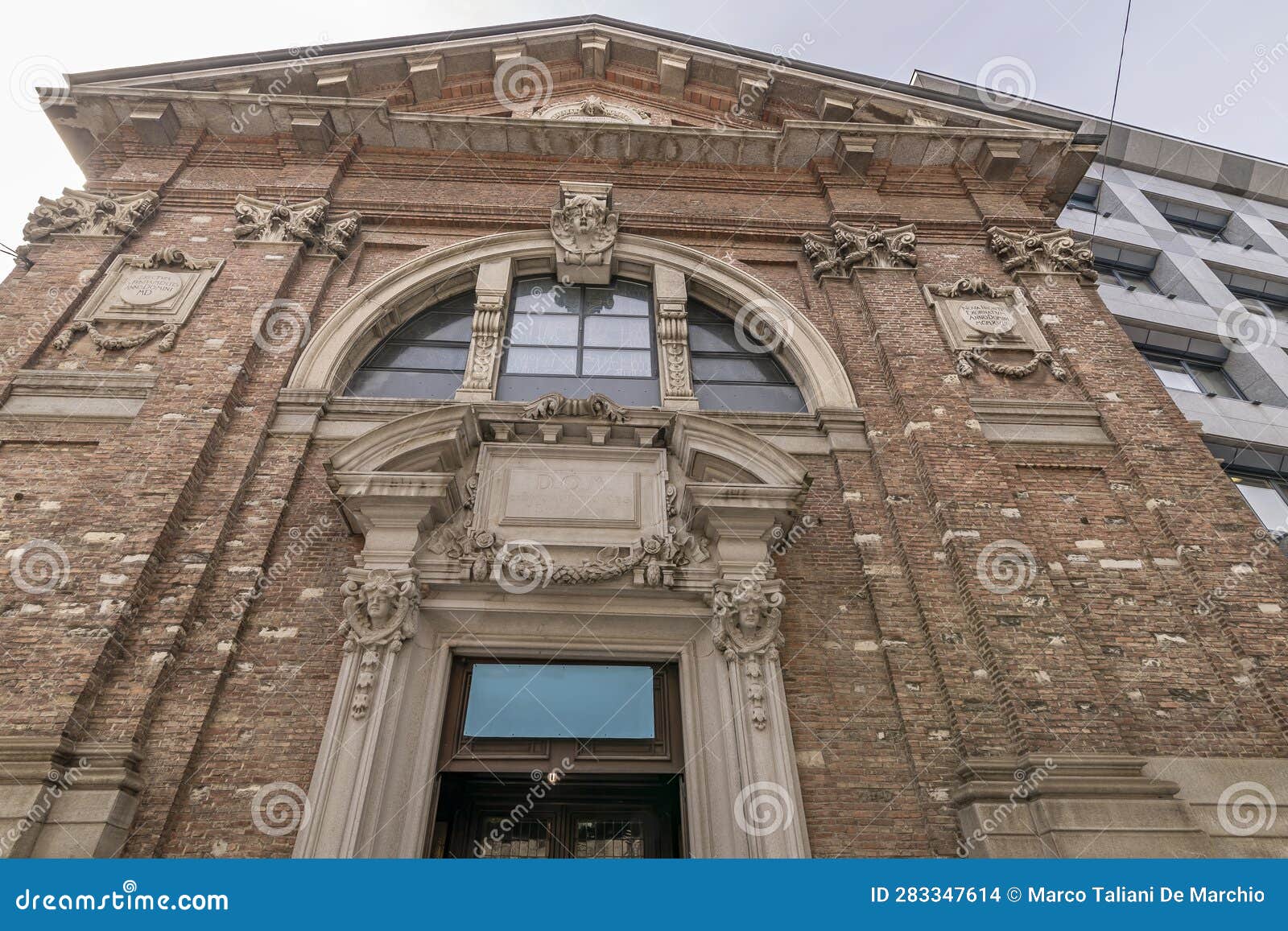 the facade of the church of sant'antonio abate, lugano, switzerland