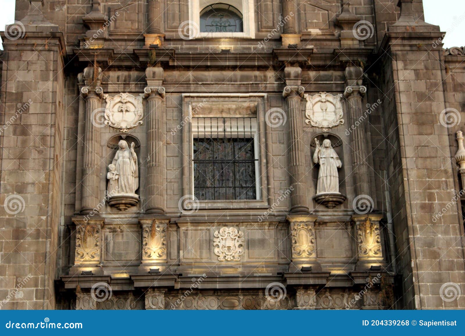 facade of puebla cathedral in puebla city, mexico