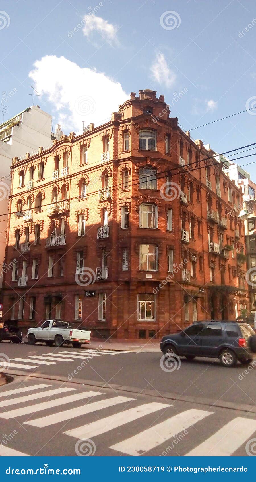 facade view of a neoclassical brick building, in republica arabe and cabello streets. buenos aires, argentina