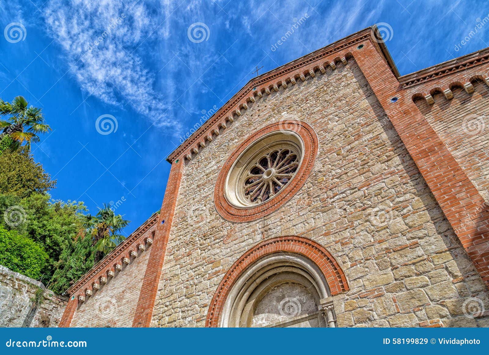 facade of xiv catholics parish church in italy