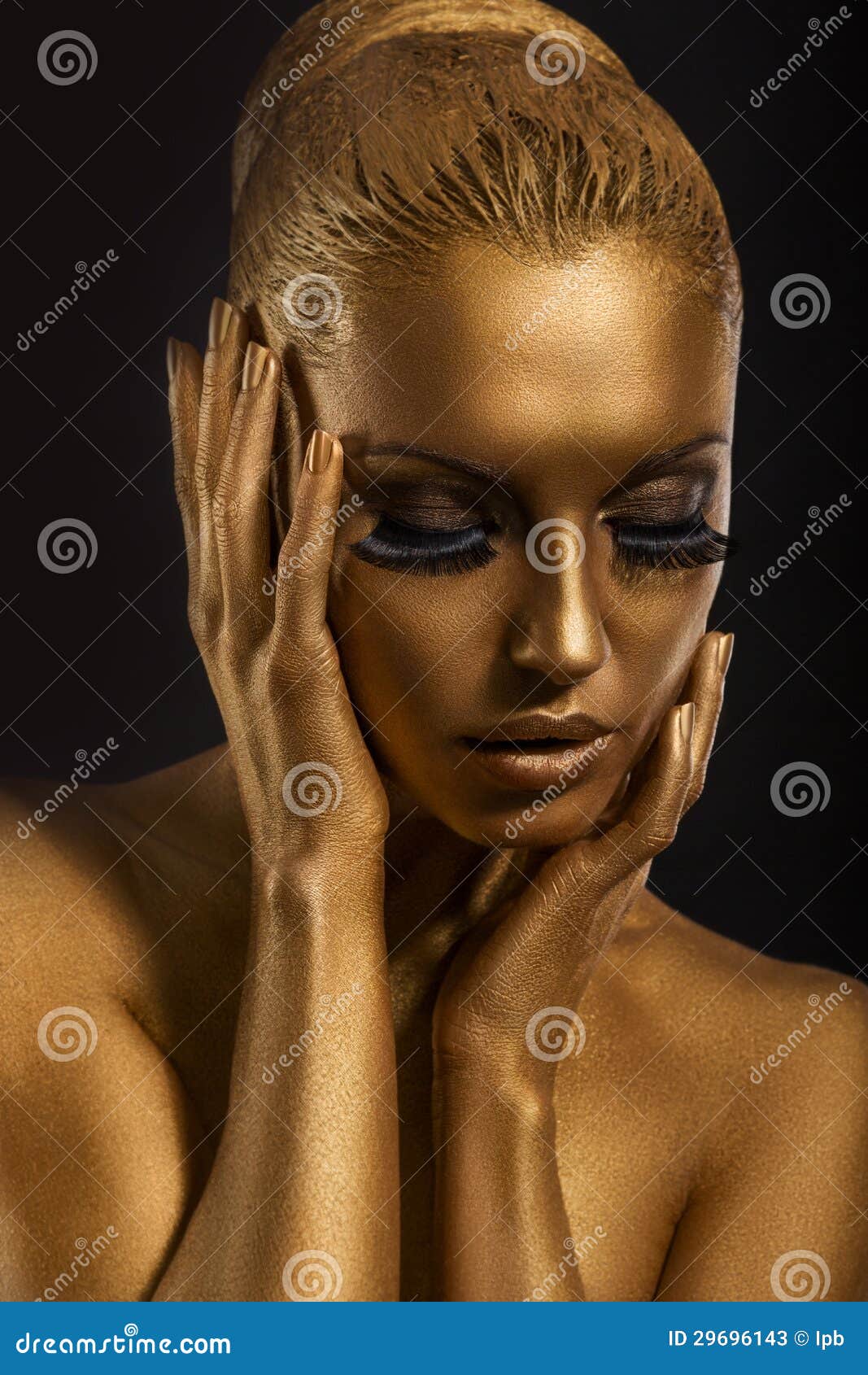 face art. fantastic gold make up. stylized colored woman's body