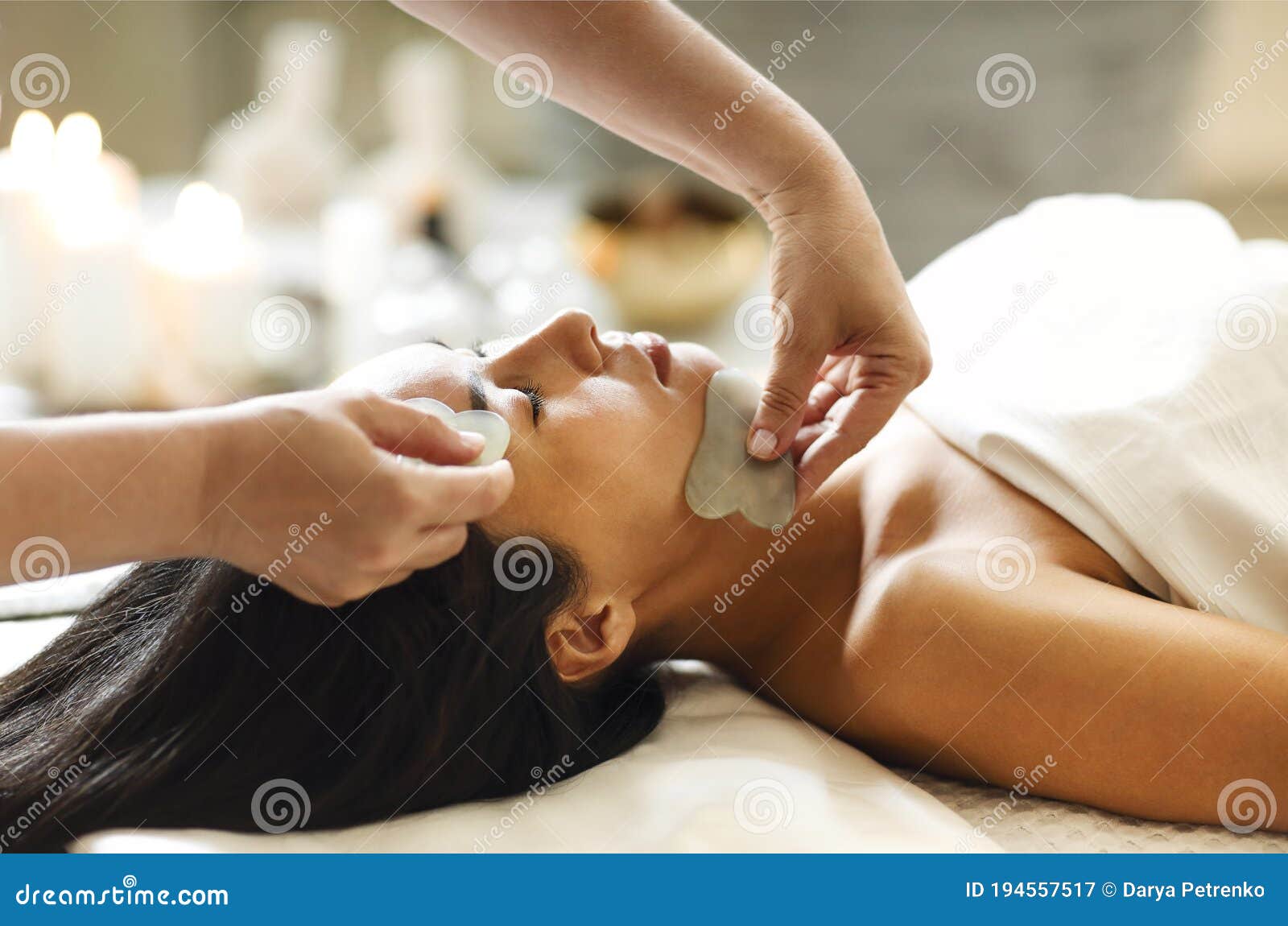 face massage or beauty treatment in spa salon