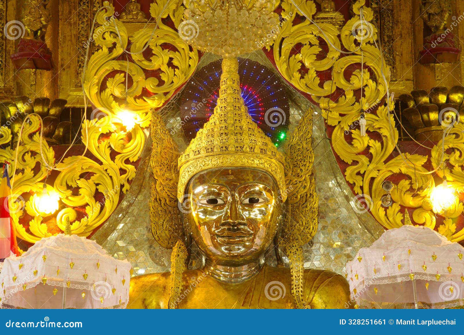 face of large golden seated buddha image is the main buddha image in the mahamuni phrya temple church.