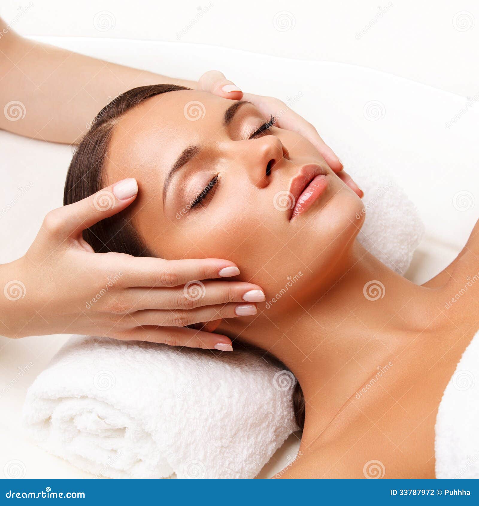 face massage. close-up of a young woman getting spa treatment.