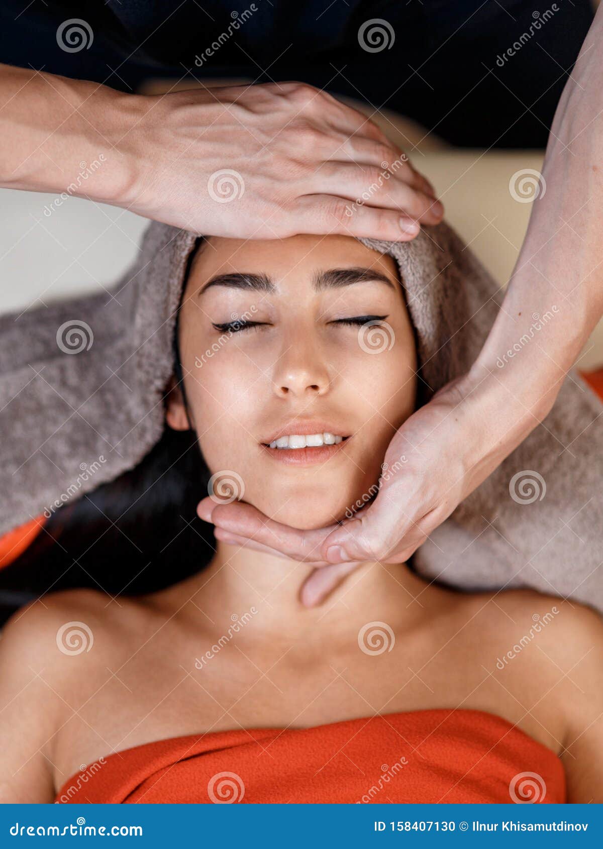 Face Massage Close Up Of Young Woman Getting Spa Massage Treatment At