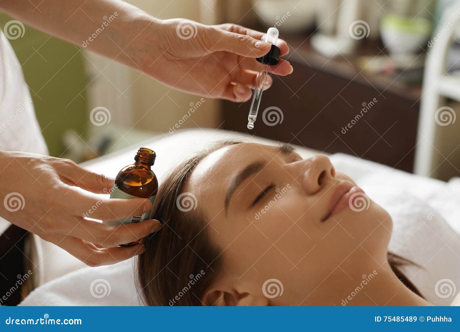 face skin care. woman receiving serum treatment in beauty salon