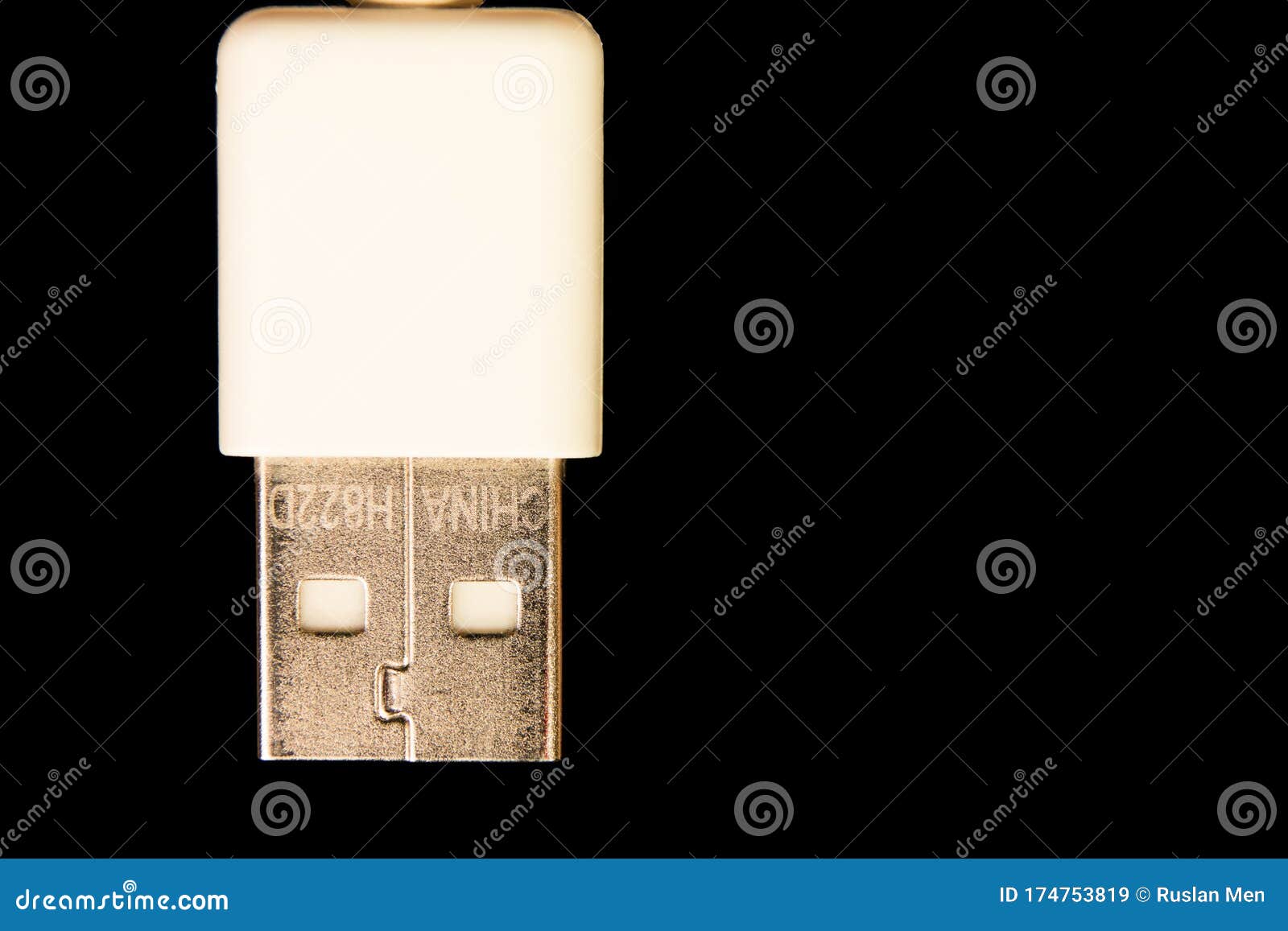 the face of usb cord head with a white hat on a black background close up