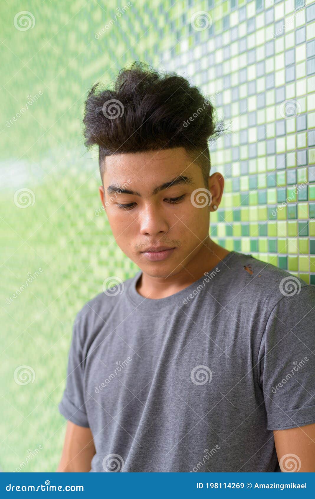 Face of Young Asian Man with Curly Hair Looking Down Against Green Wall  Outdoors Stock Image - Image of background, curly: 198114269