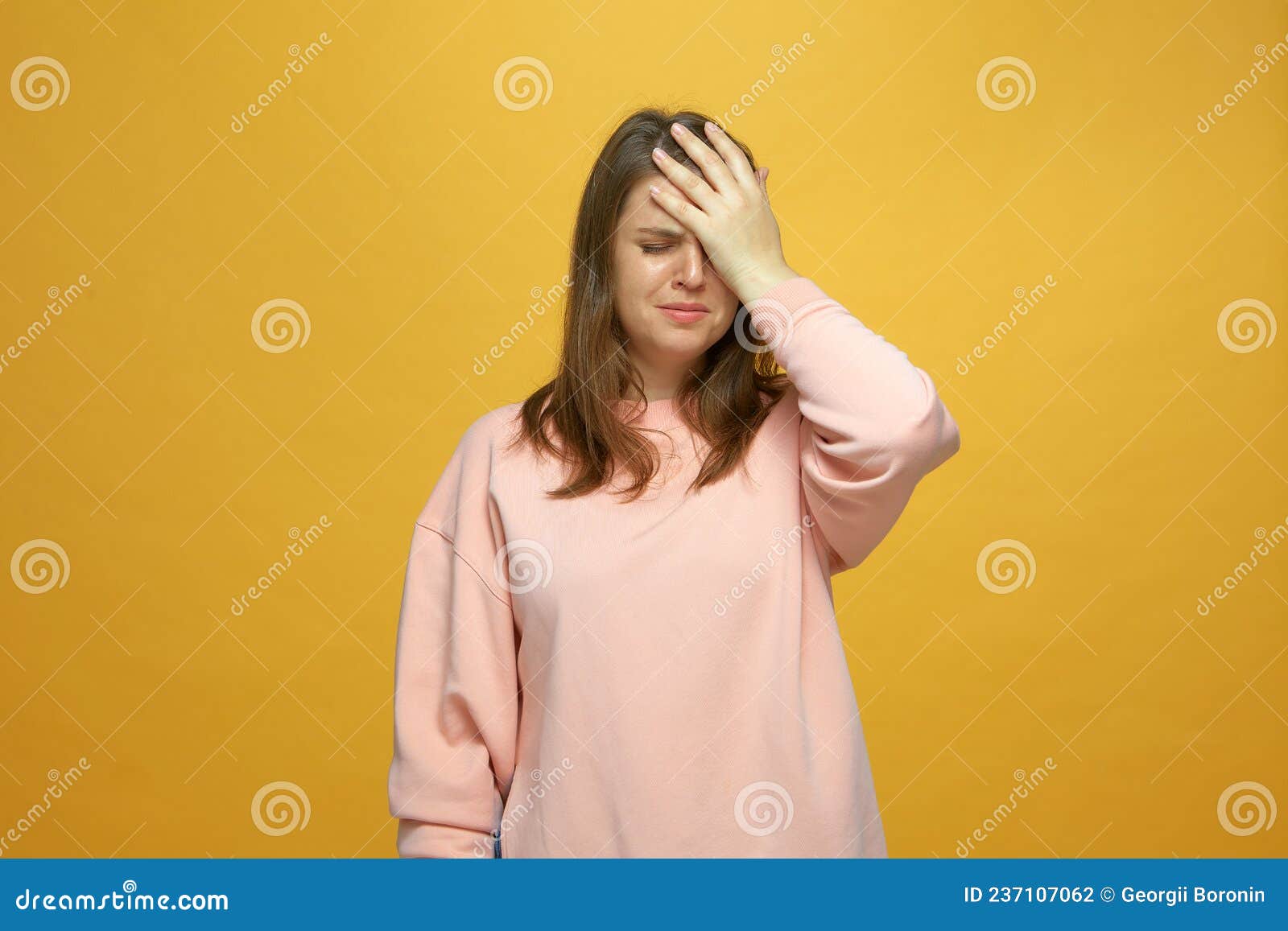 facepalm gesture. desperate upset girl blame herself for bad memory, mistake, feel sorrow, shame on yellow background