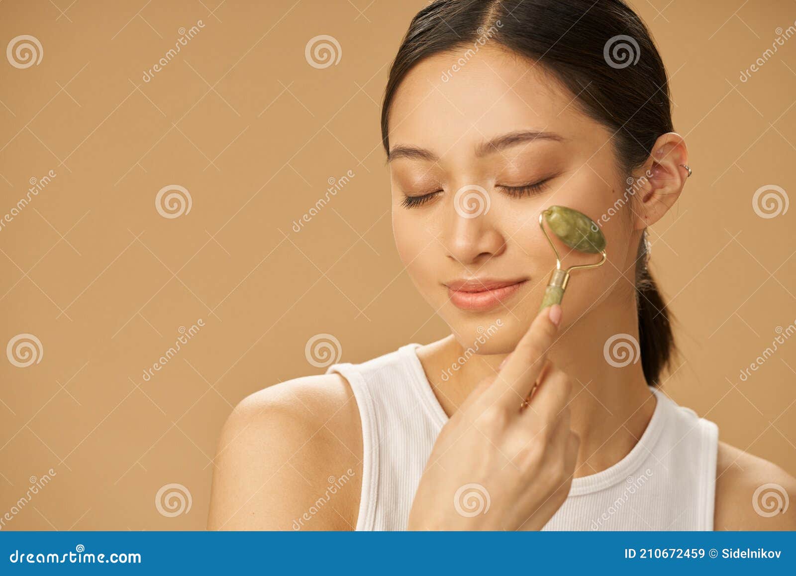 Facial Beauty Treatment Beautiful Young Woman Looking Relaxed While Getting Massage Face Using