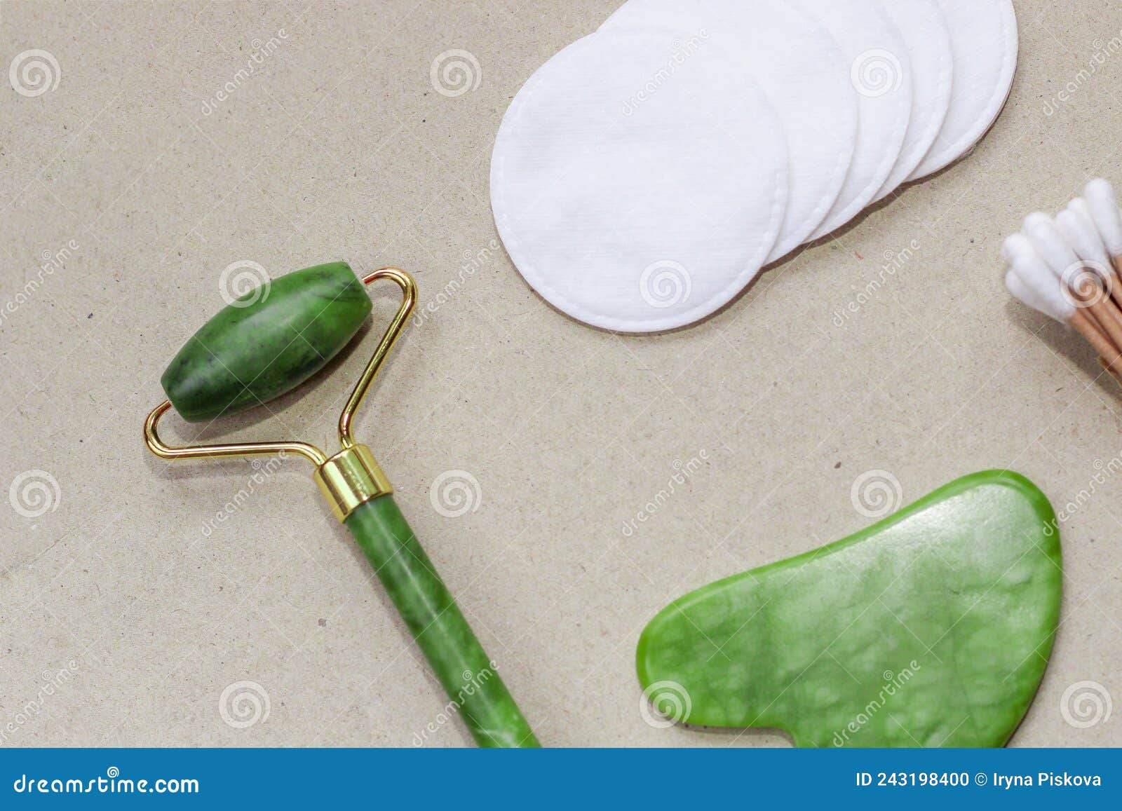 Facial Massage Jade Gouache Scraper and Face Roller on Abstract Paper