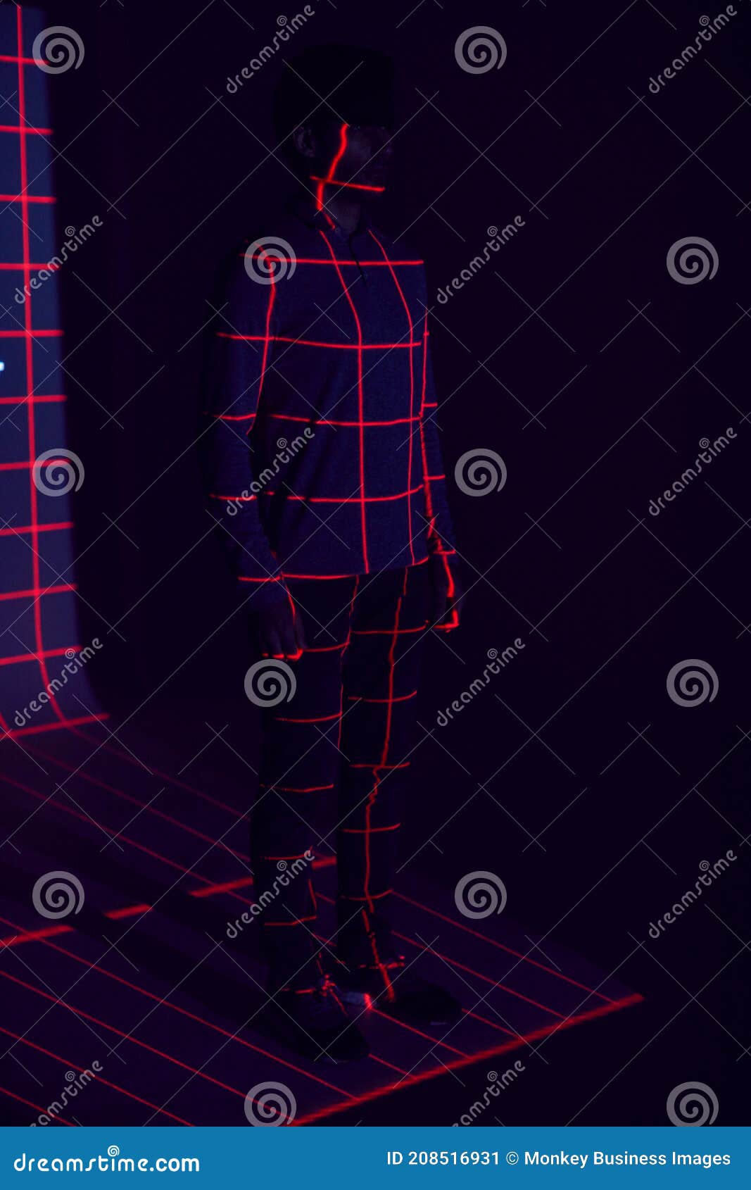 facial recognition technology concept as man has red grid projected onto body in studio