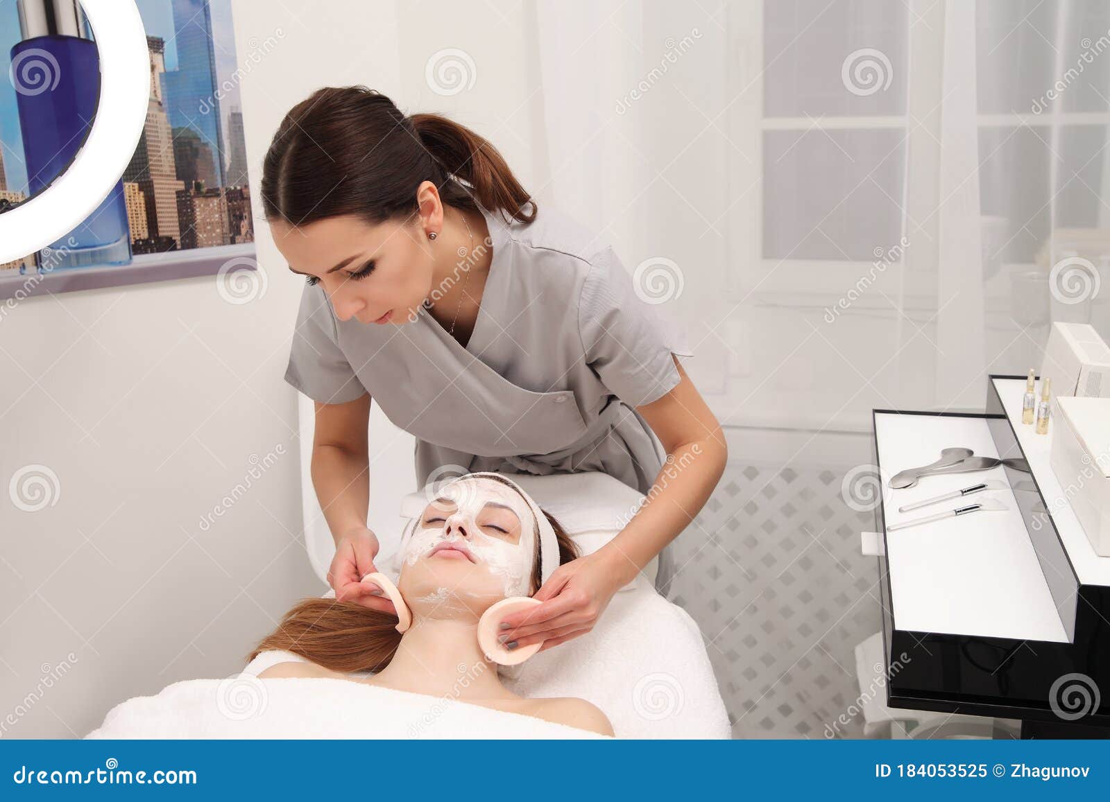 Facial Treatment Of Young Woman In A Cosmetology Salon Stock Image