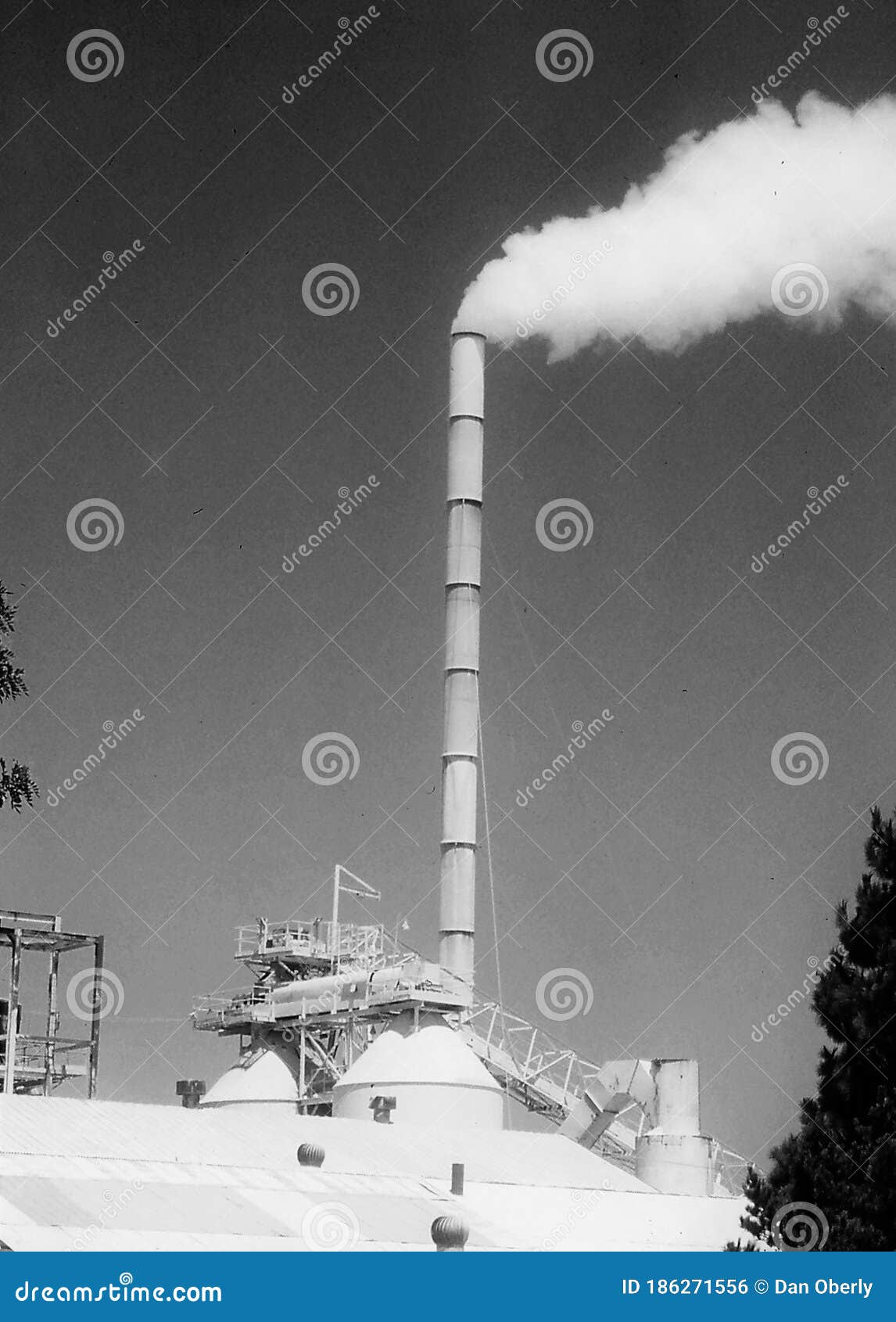 factory chimney spews smoke