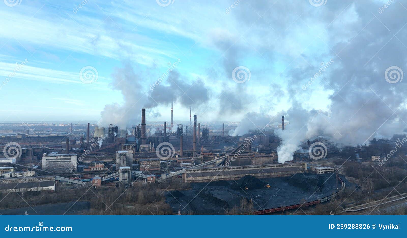 factory metal steel processing hot, dron aerial video shot, smoke chimneys rises black poison, smog in city ostrava