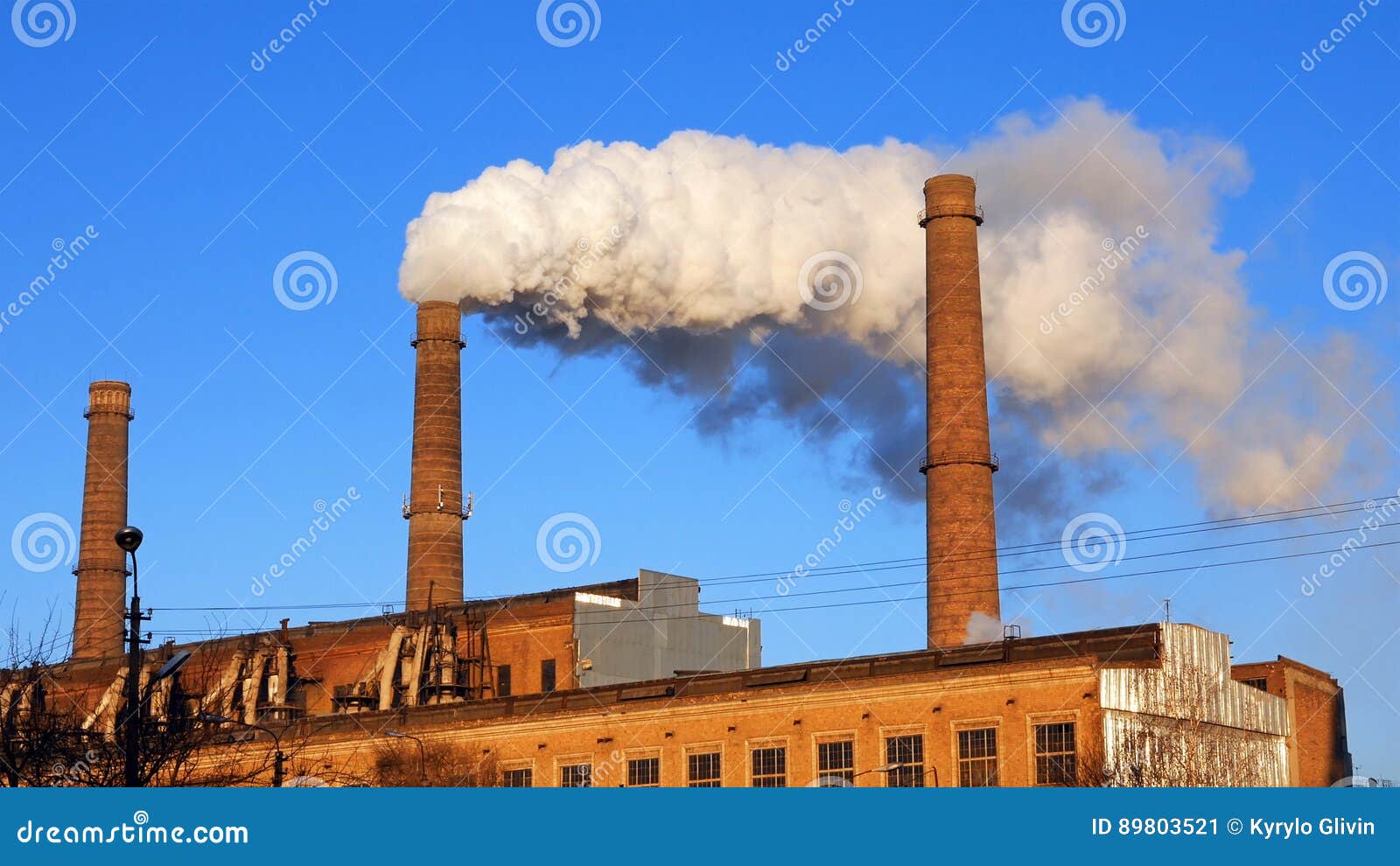 Factory Plant Smoke Stack Over Blue Sky Background - Image of blue, puff: