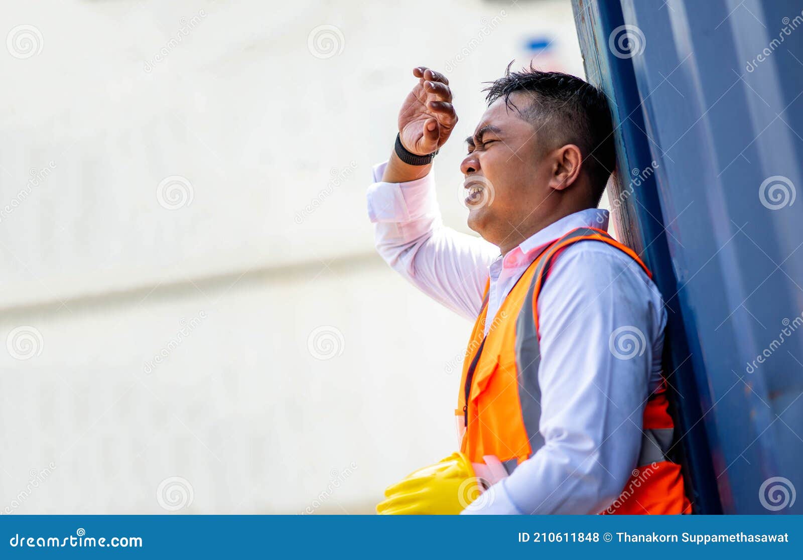 factory worker man working in hot weather and he look tired from work