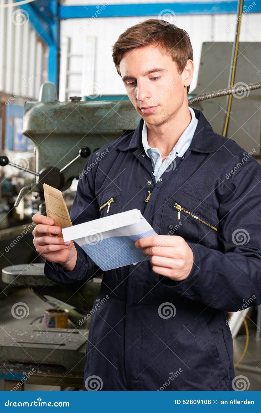 Factory Worker Opening Wage Packet Stock Photo Image of vertical