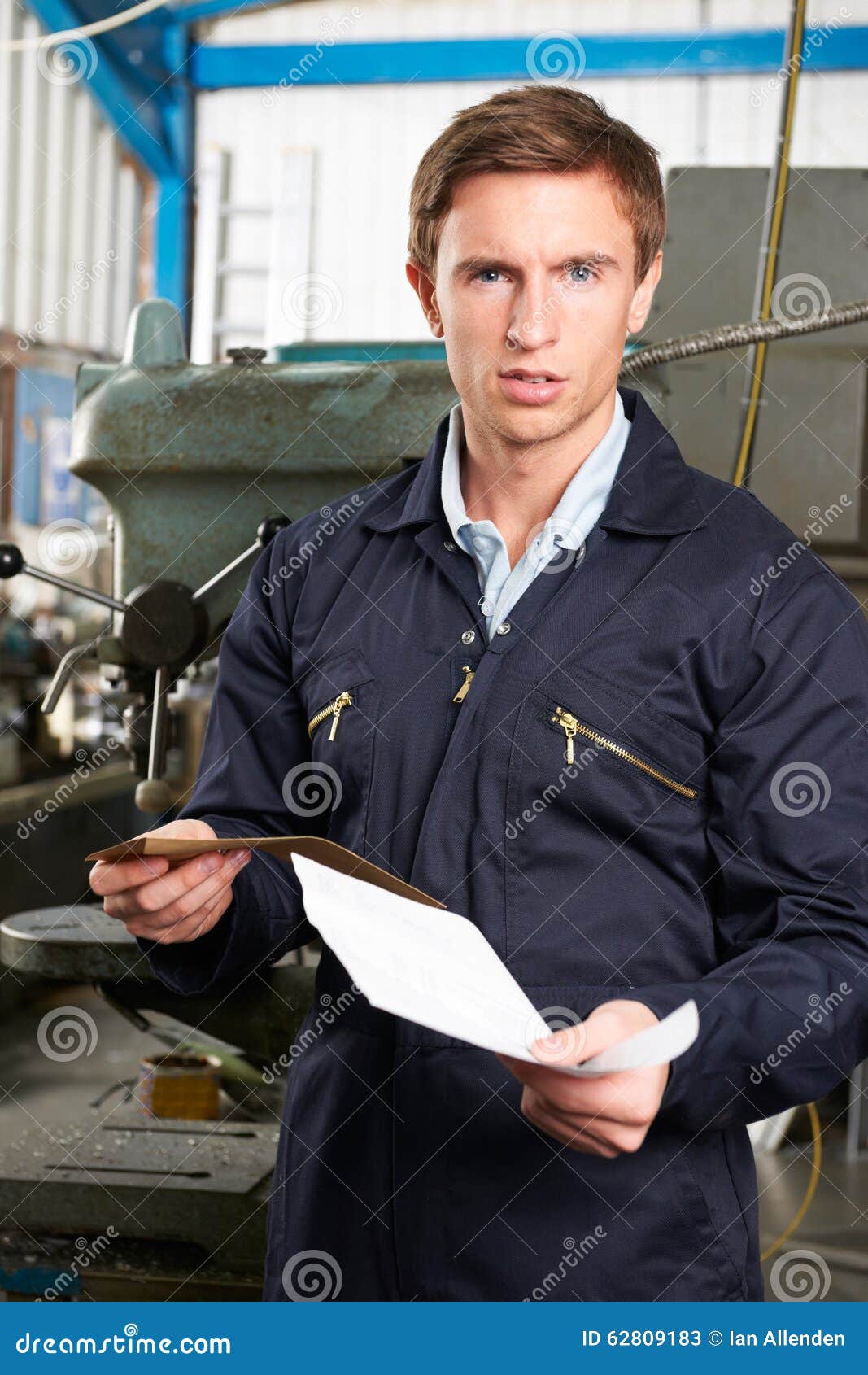 factory worker reading redundancy letter