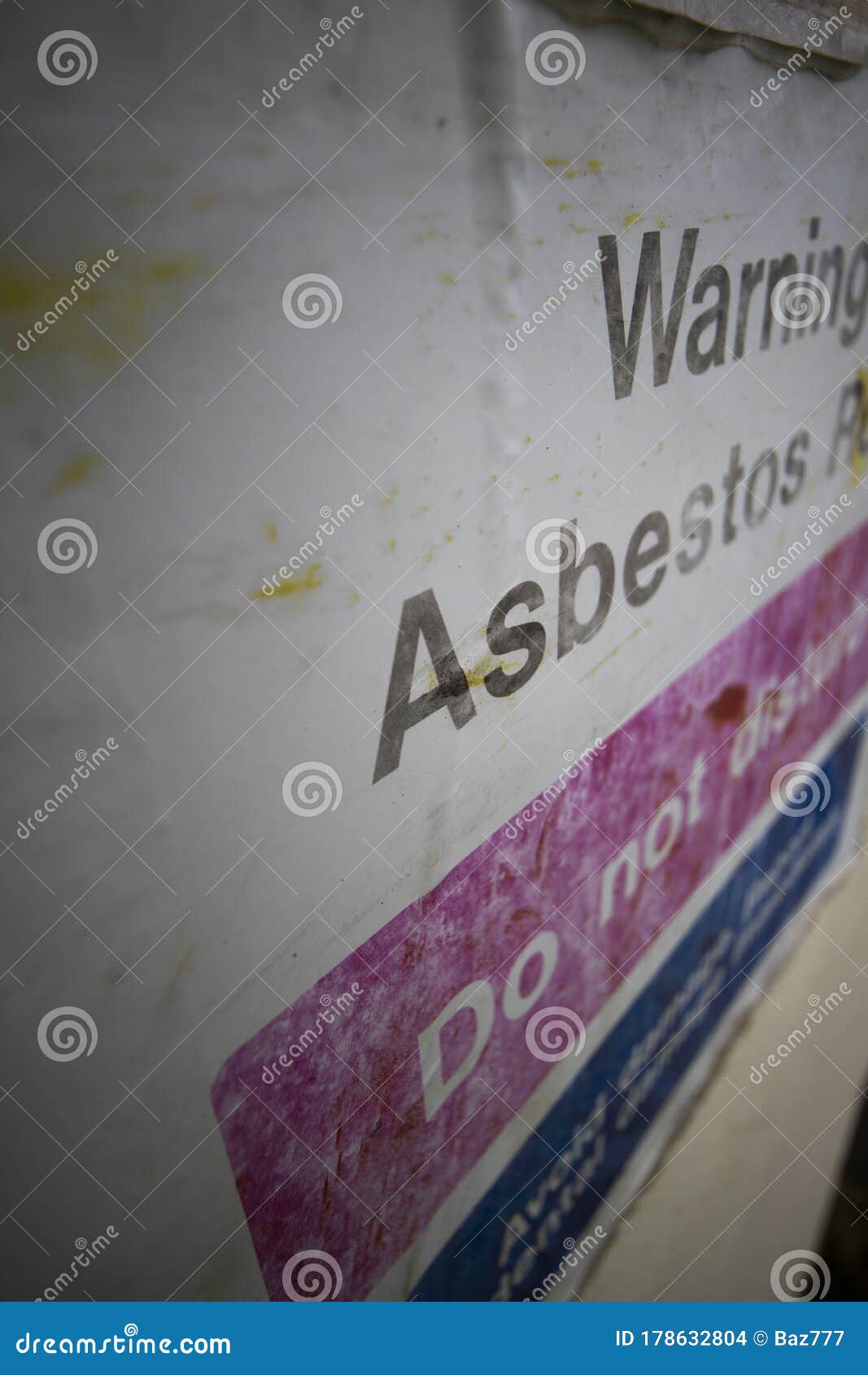 faded asbestos roof warning sign